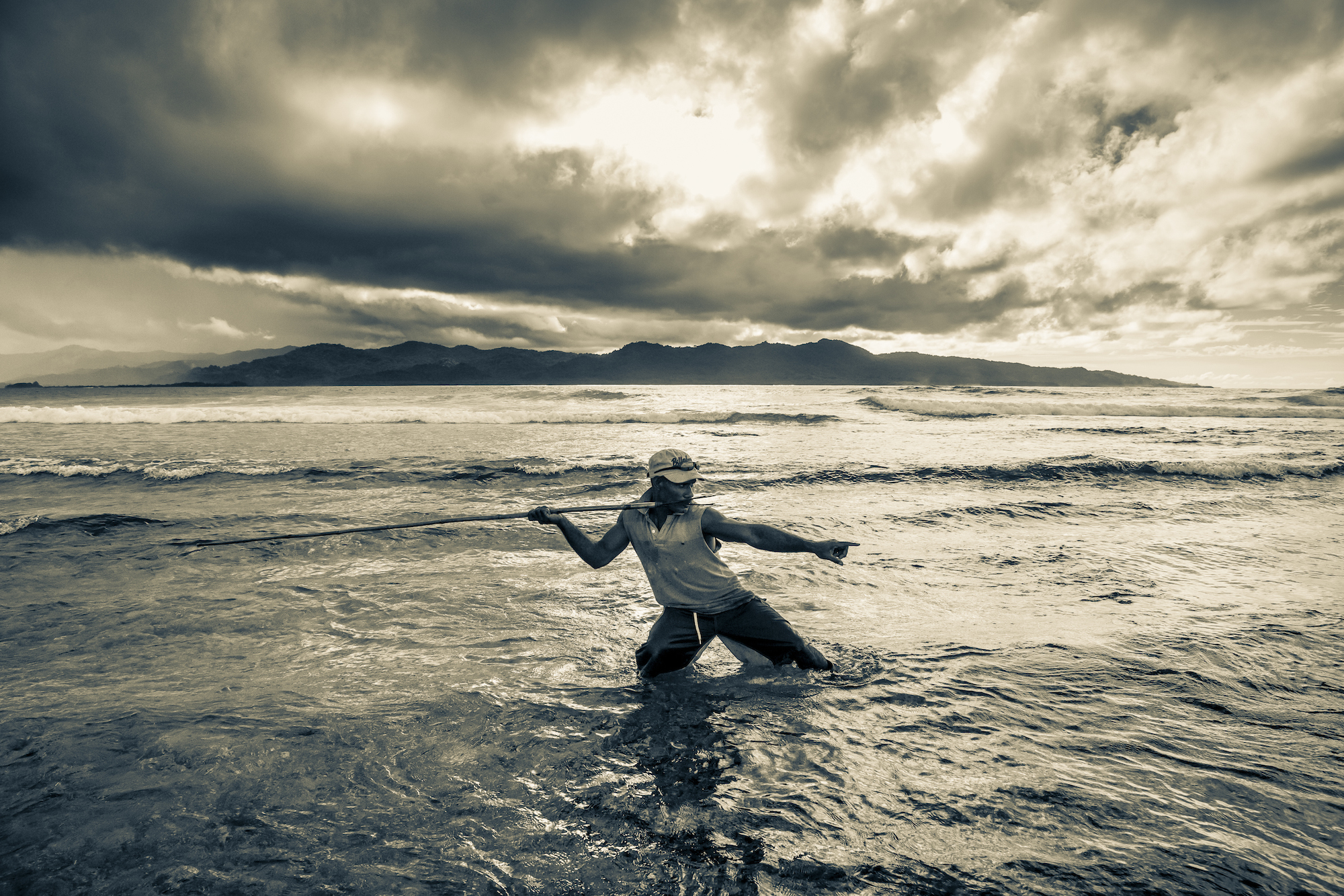 Lonsdale, a Solomon Islander from a remote village in the Makira Province, spear fishes in the shallows near Frigate Bird Island. Photographed in Solomon Islands while working on Islands of Creation: https://vimeo.com/74694051