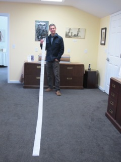 Project Coordinator Eric Rutledge with 2013's property tax receipt