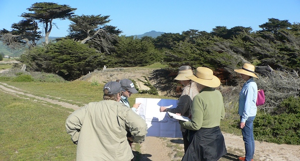 CLT Stewardship Volunteers and Executive Director Jo Chamberlain review trail plans