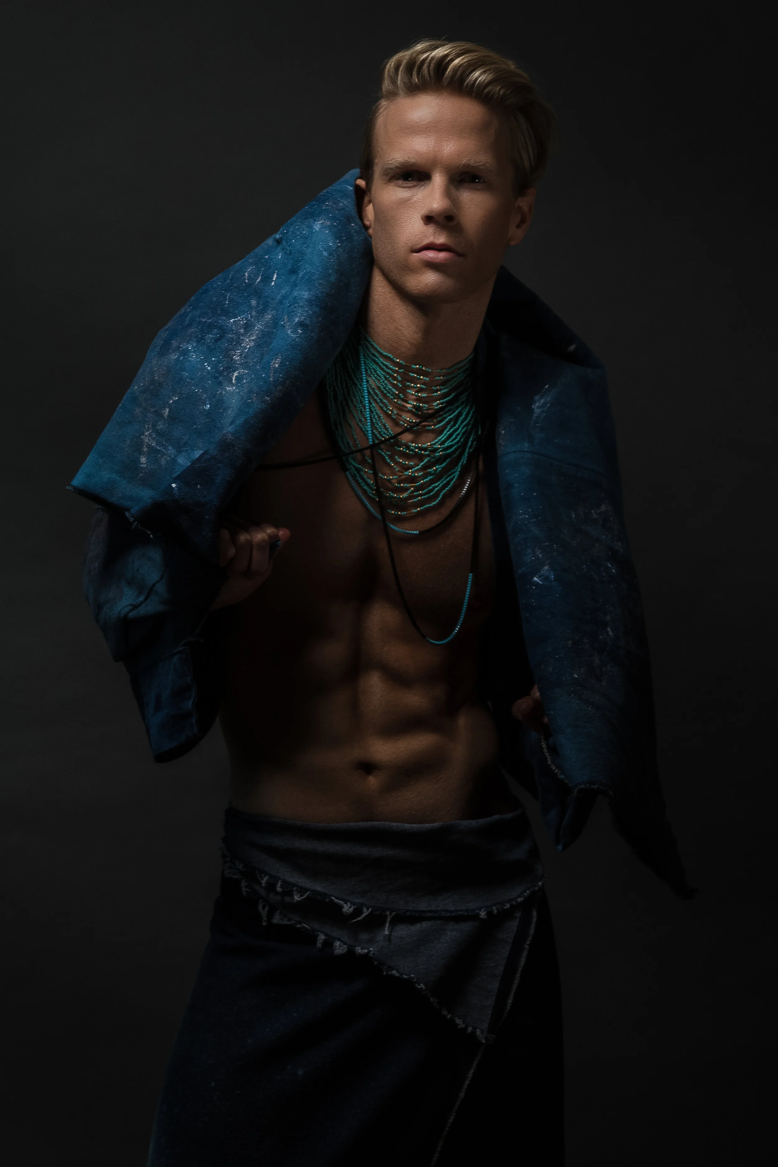 Model: Andrew M Photographer: Brian Thomas Artistic Director/Stylist: Wes Veldink Denim Kimono: Boneles Denim skirt: Wes Veldink & Aimee G. Creative: Chris Newsome