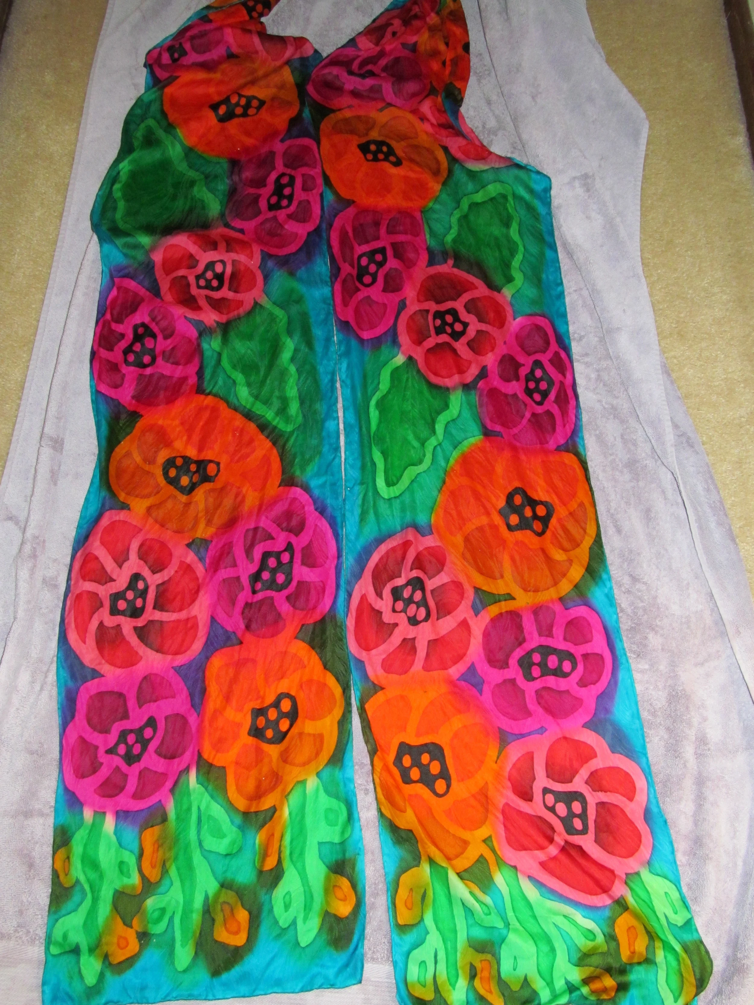 Hand painted silk scarves ready to roll up!