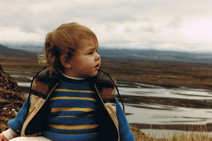 Me, probably just under two, overlooking an Icelandic landscape.&nbsp; Sweater (not Icelandic) was hand-knit by my great grandmother.