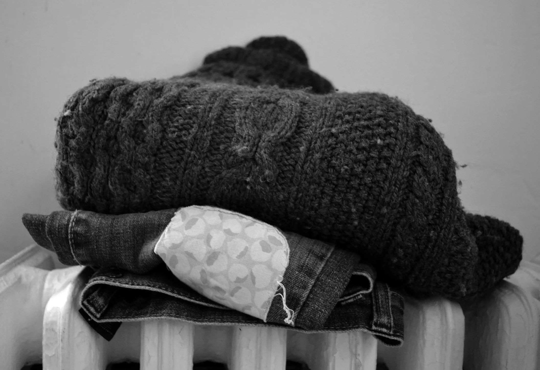 (A sweater that I made long ago, and that gets WORN well each winter, along with some favorite jeans that are now threadbare and mended several times over.)