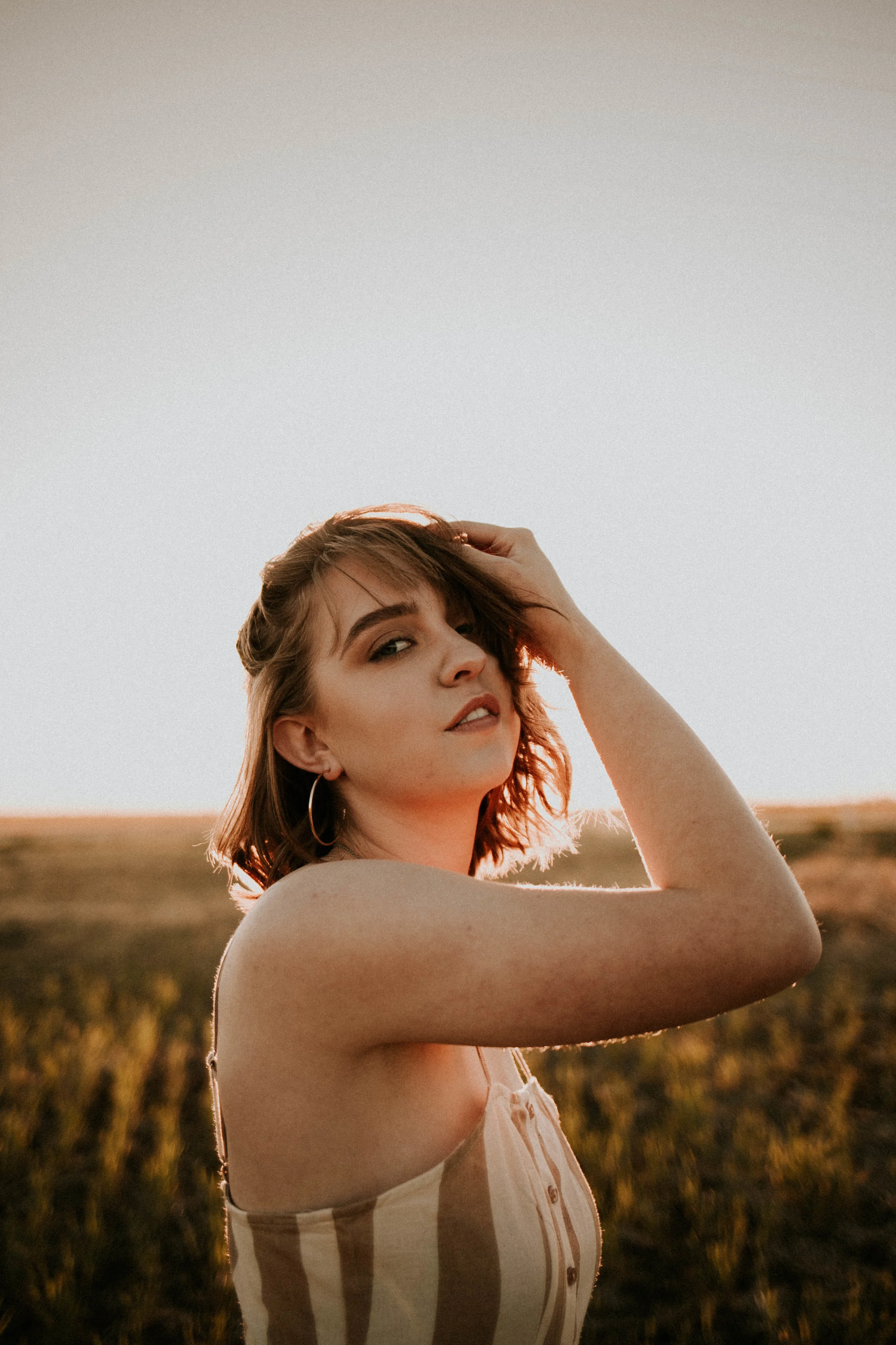Girl Senior Photos | Field Photos | Photo Ideas for Grads | Cute Senior Photo Poses