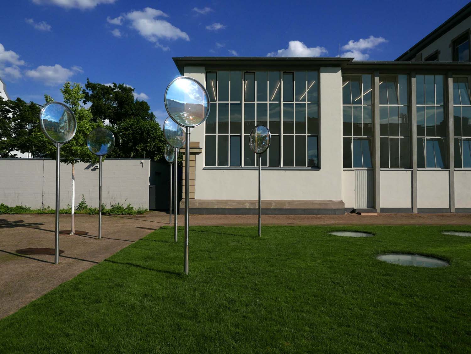 Part of the Städelschule (Städel art school) with the skylights of the contemporary galleries visible in the grass