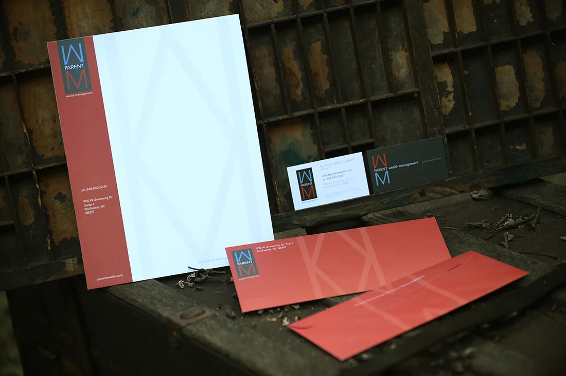 Letterhead and envelopes incorporated a wrap around pattern made out of the logo letters W and M. End result was a cohesive and striking brand presence.