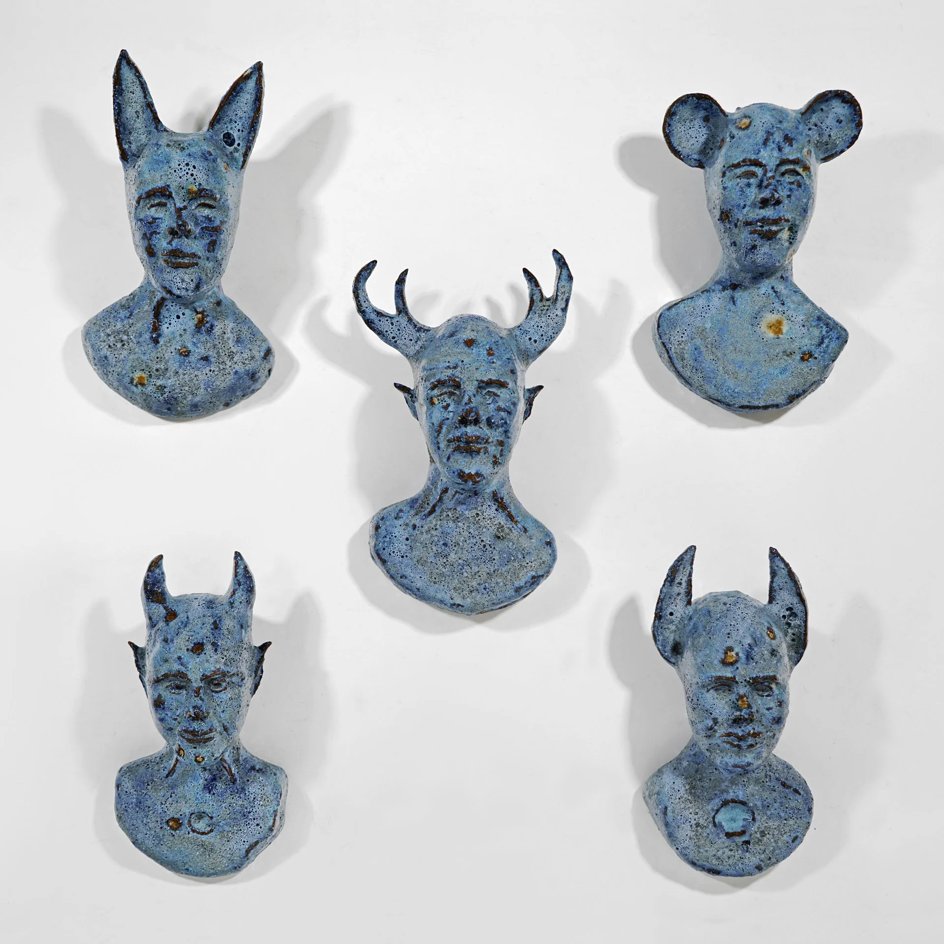 Wildlings, 2023. Clay, glaze. Approx. 9" high each.
