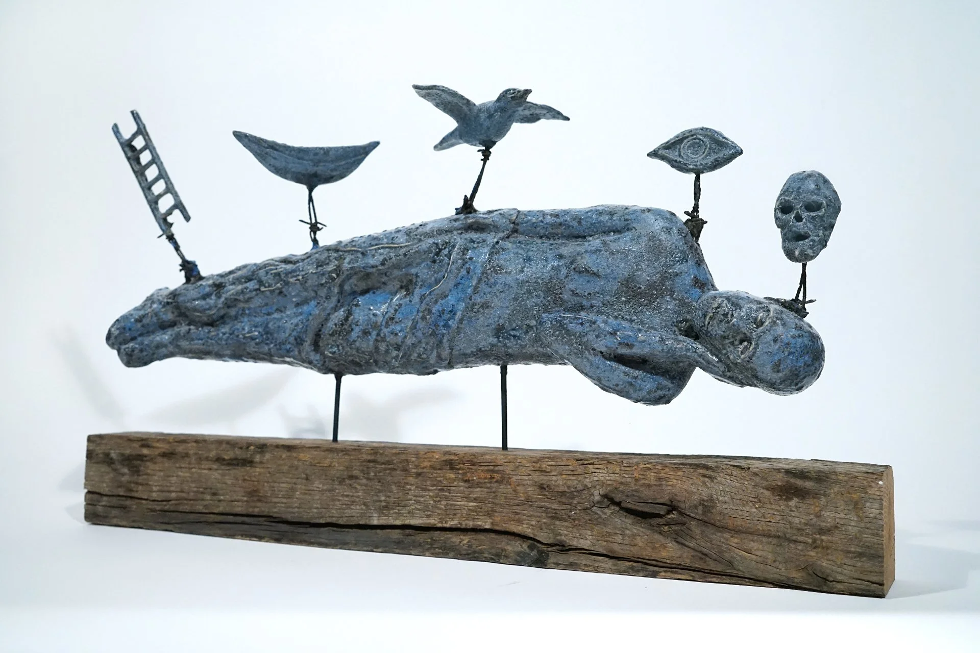 Dreaming, 2019. Clay, glaze, found wood. Approx. 11" high x 21" w