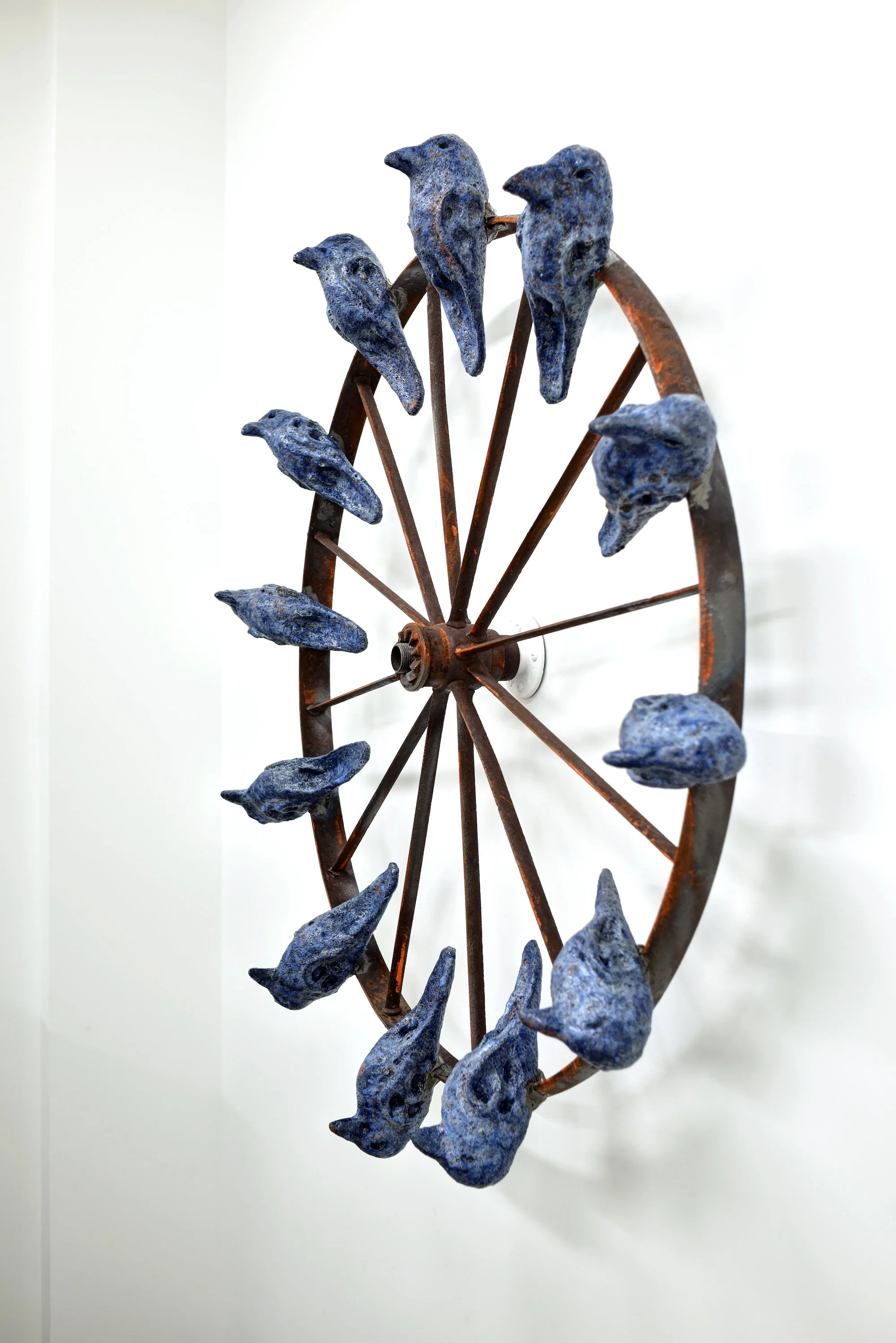 Flywheel, 2017. Clay, glaze, found wheel. Approx. 36" diameter