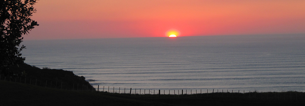 Sunset from Cbarn accommodation, Ngarunui beach, Raglan.