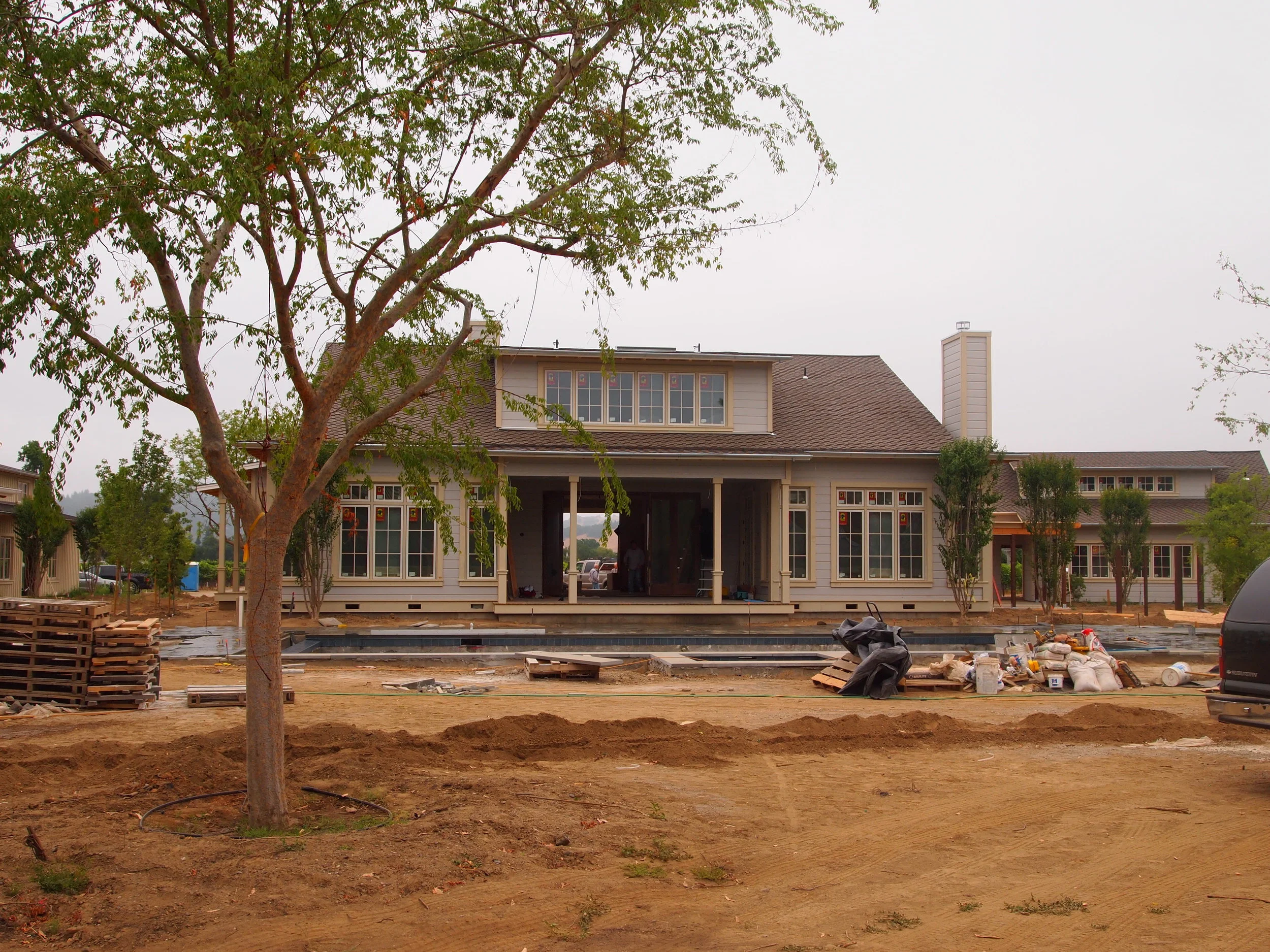 Rear exterior of traditional country ranch estate home.