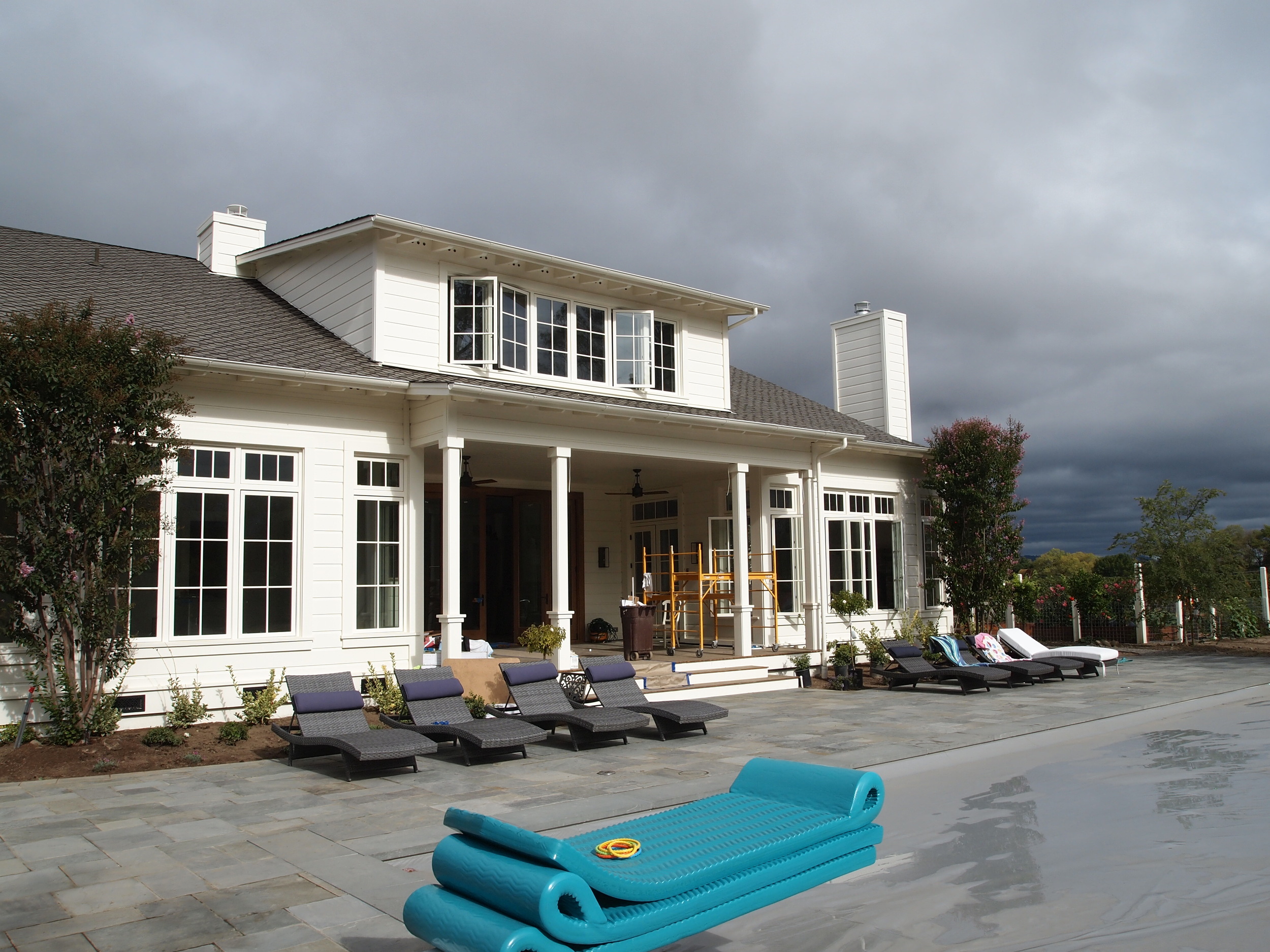   Rear shot of modern farmhouse&nbsp;poolside - nearing completion.  