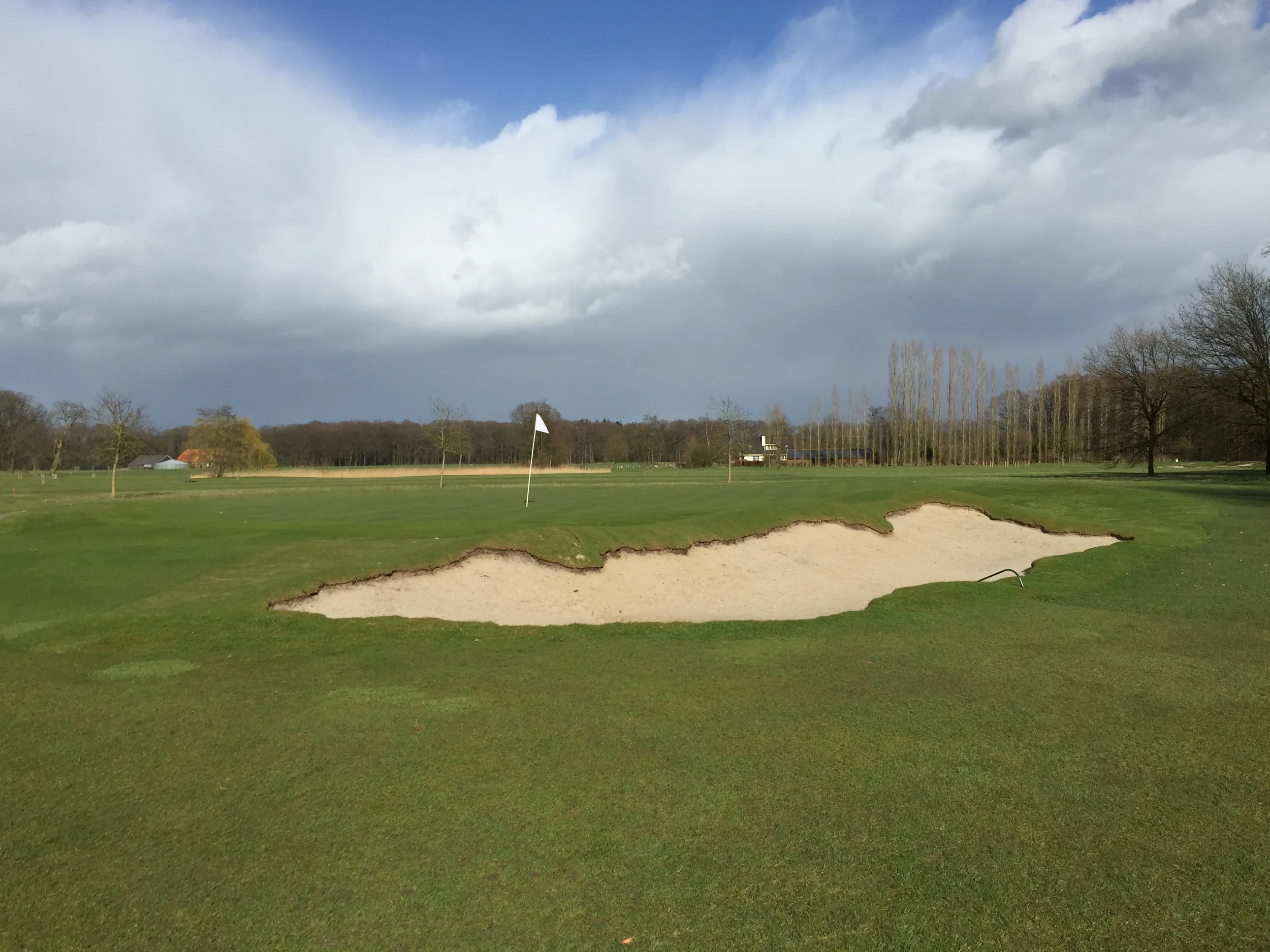 Hole 12 Green after with one of the simplest but in my opinion best looking bunkers on the course. The exposed dirt on the left above is a newly seeded hollow. 