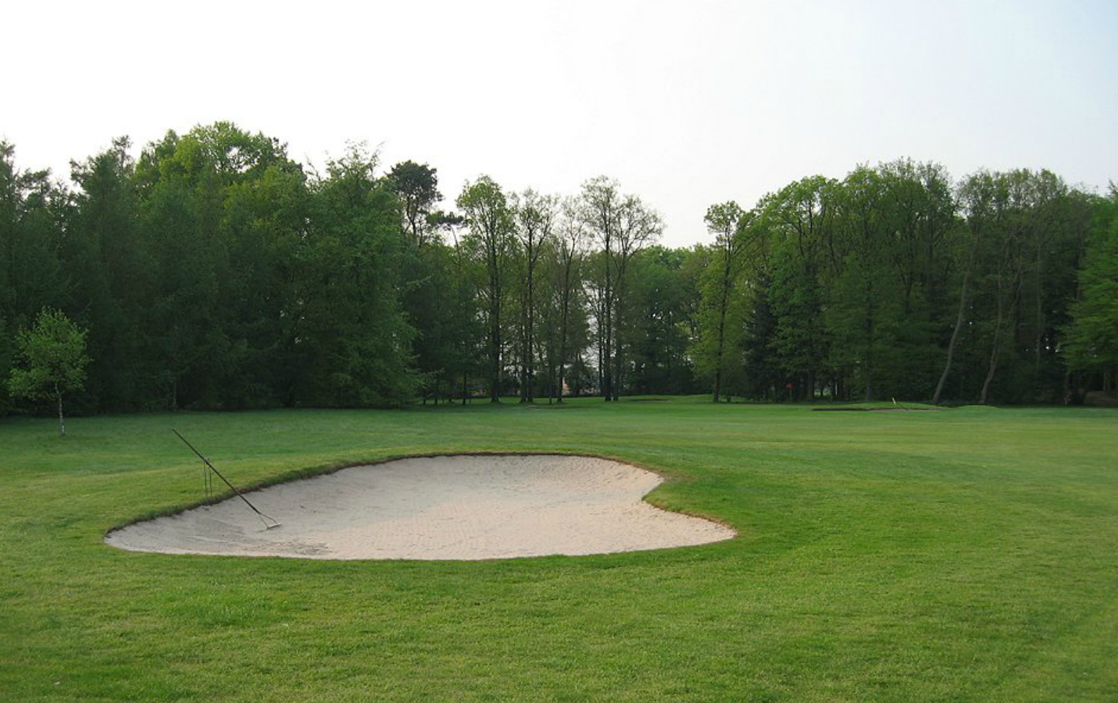 Hole 16 before from the left fairway bunker.
