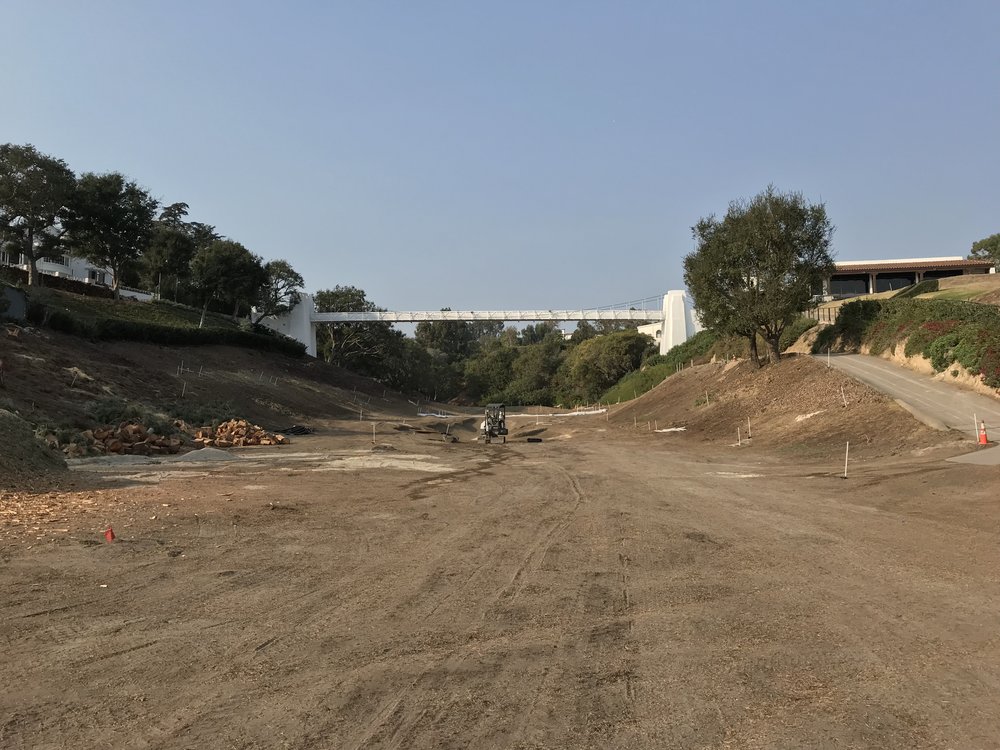  The famous bridge on the 10th hole at Bel-Air going over the 18th green 