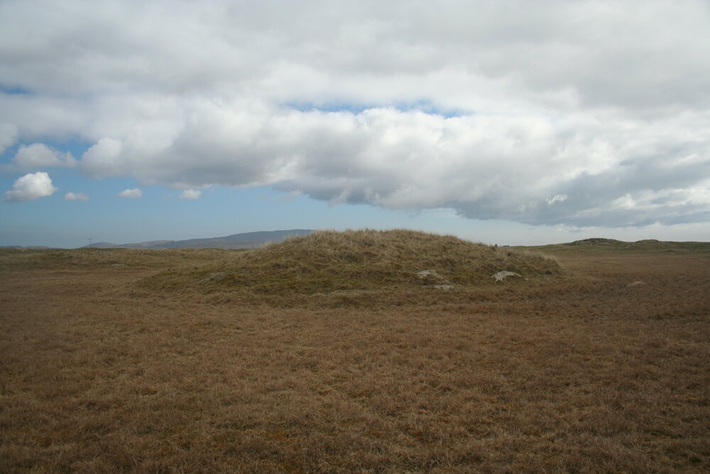 Behind the mound in fairway