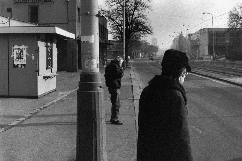 2men_1hunchedsmoking_tram.jpg
