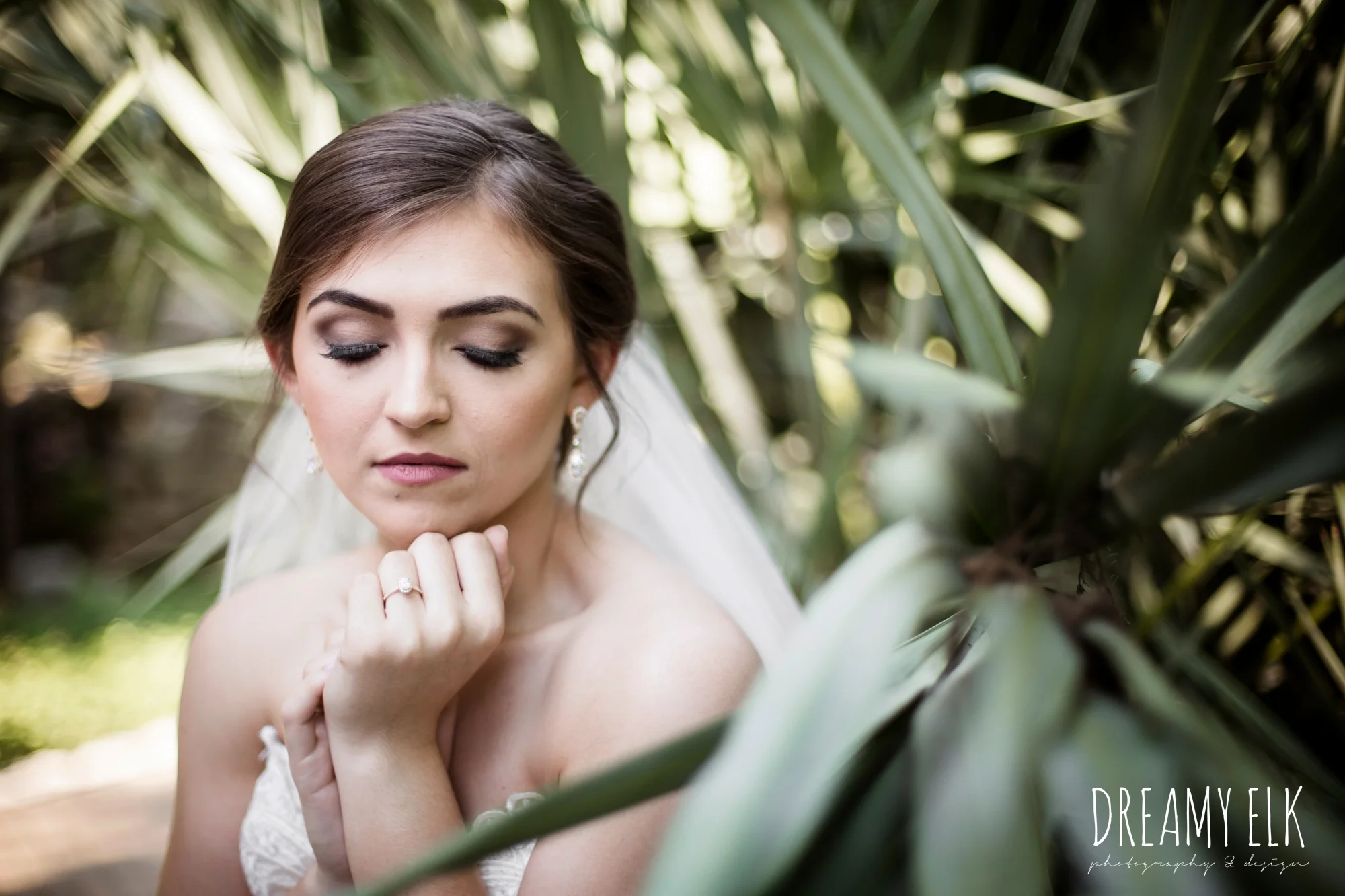 outdoor bridal photo, lace fit and flare sweetheart wedding dress, purple wedding bouquet, long veil, wedding hair up, zilker botanical gardens, austin, texas {dreamy elk photography and design}