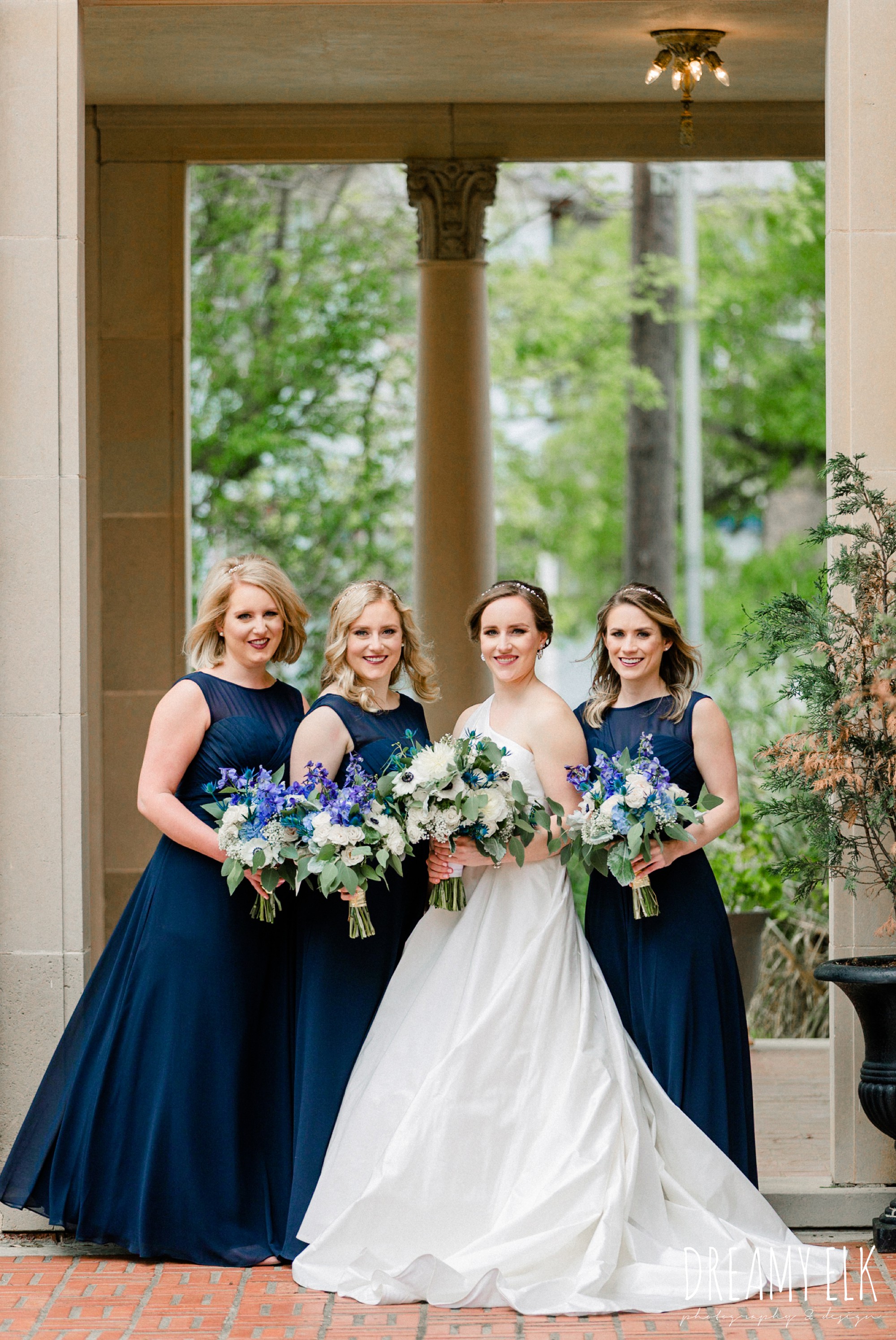 blue wedding bouquet, long navy bridesmaid dress, modern wedding dress ballgown, spring wedding, the astin mansion, bryan, texas, spring wedding, dreamy elk photography and design