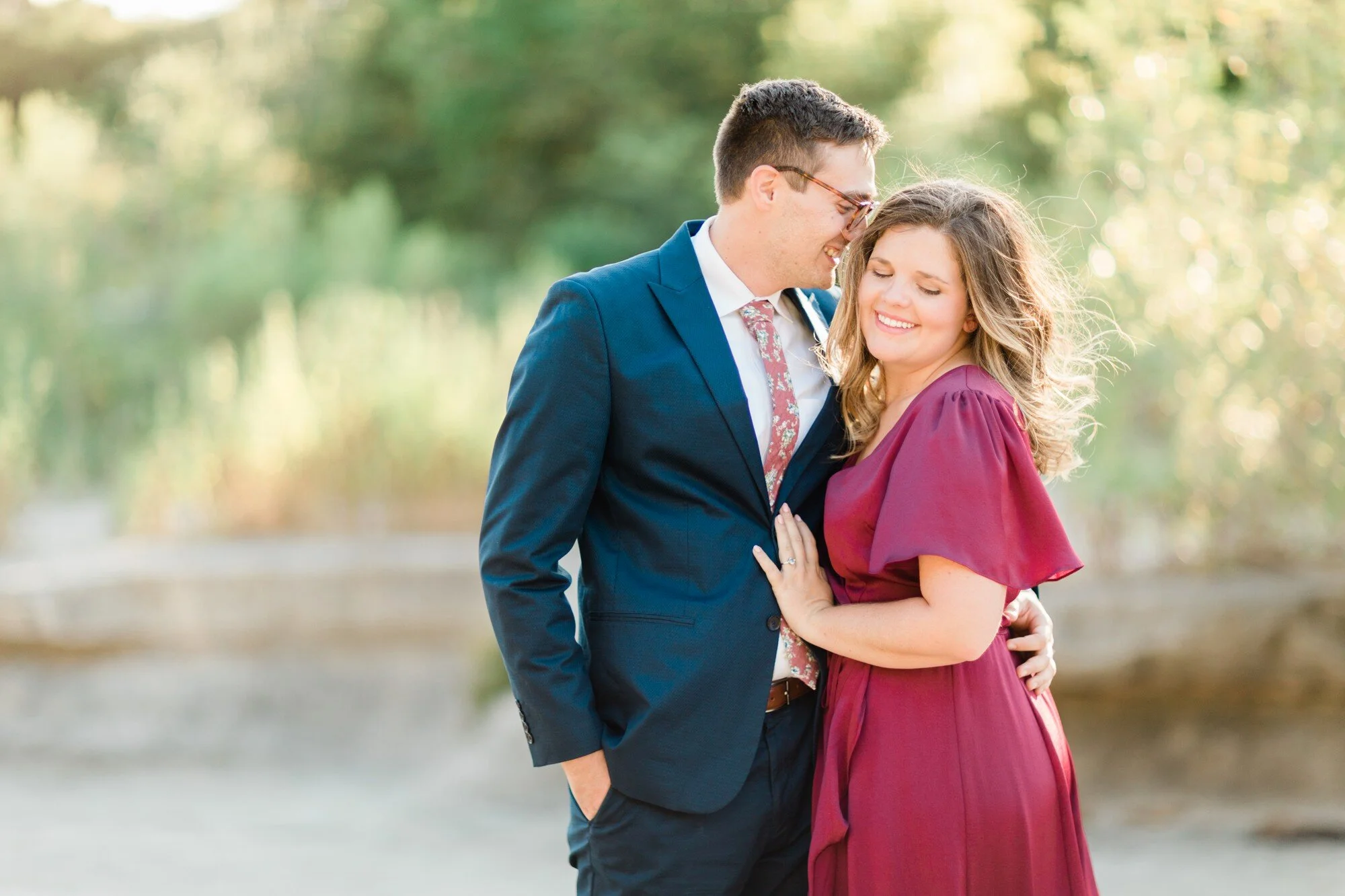 bull creek park austin texas engagement photo, burgundy dress and suit