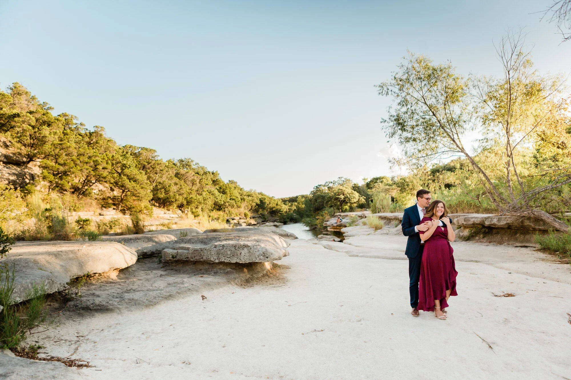bull creek park austin texas engagement photo, burgundy dress and suit