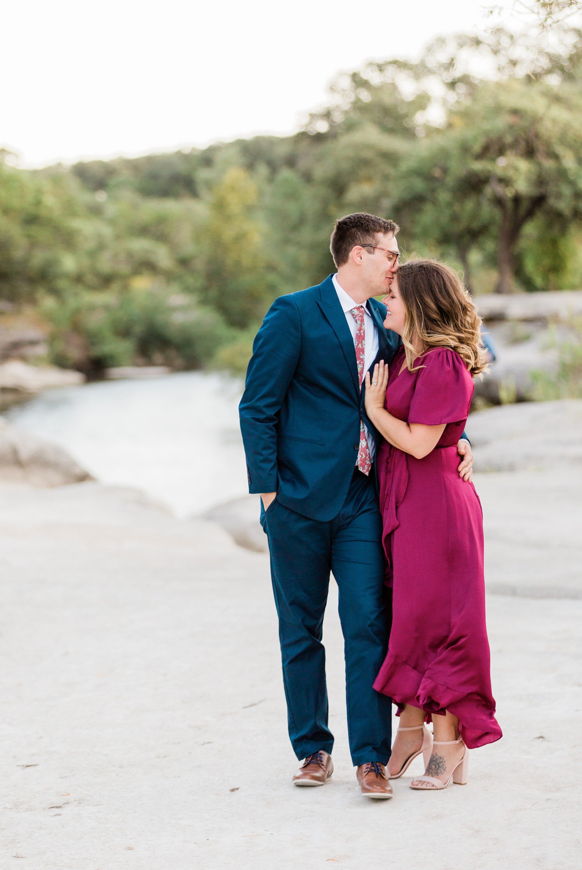 bull creek park austin texas engagement photo, burgundy dress and suit