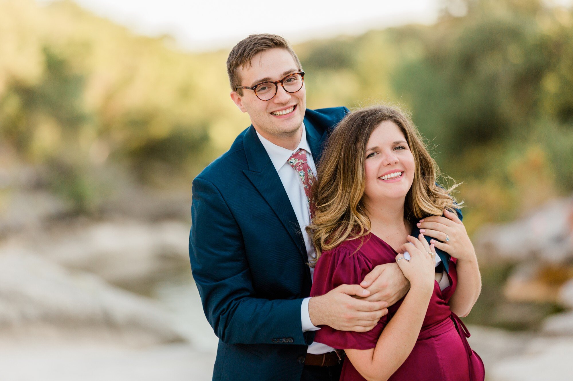 bull creek park austin texas engagement photo, burgundy dress and suit