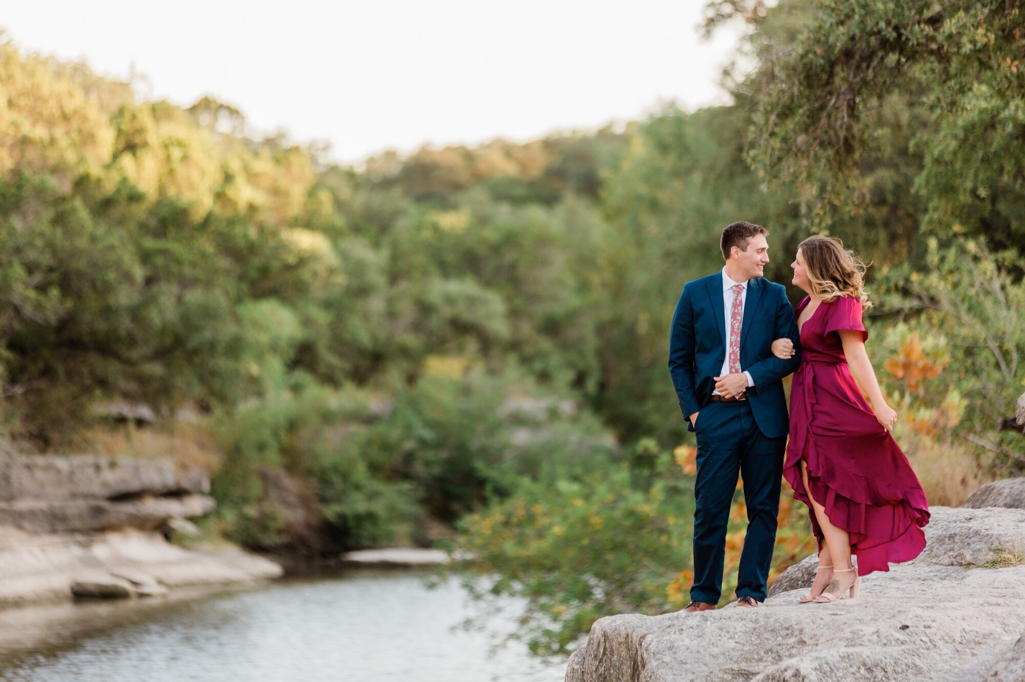 bull creek park austin texas engagement photo, burgundy dress and suit