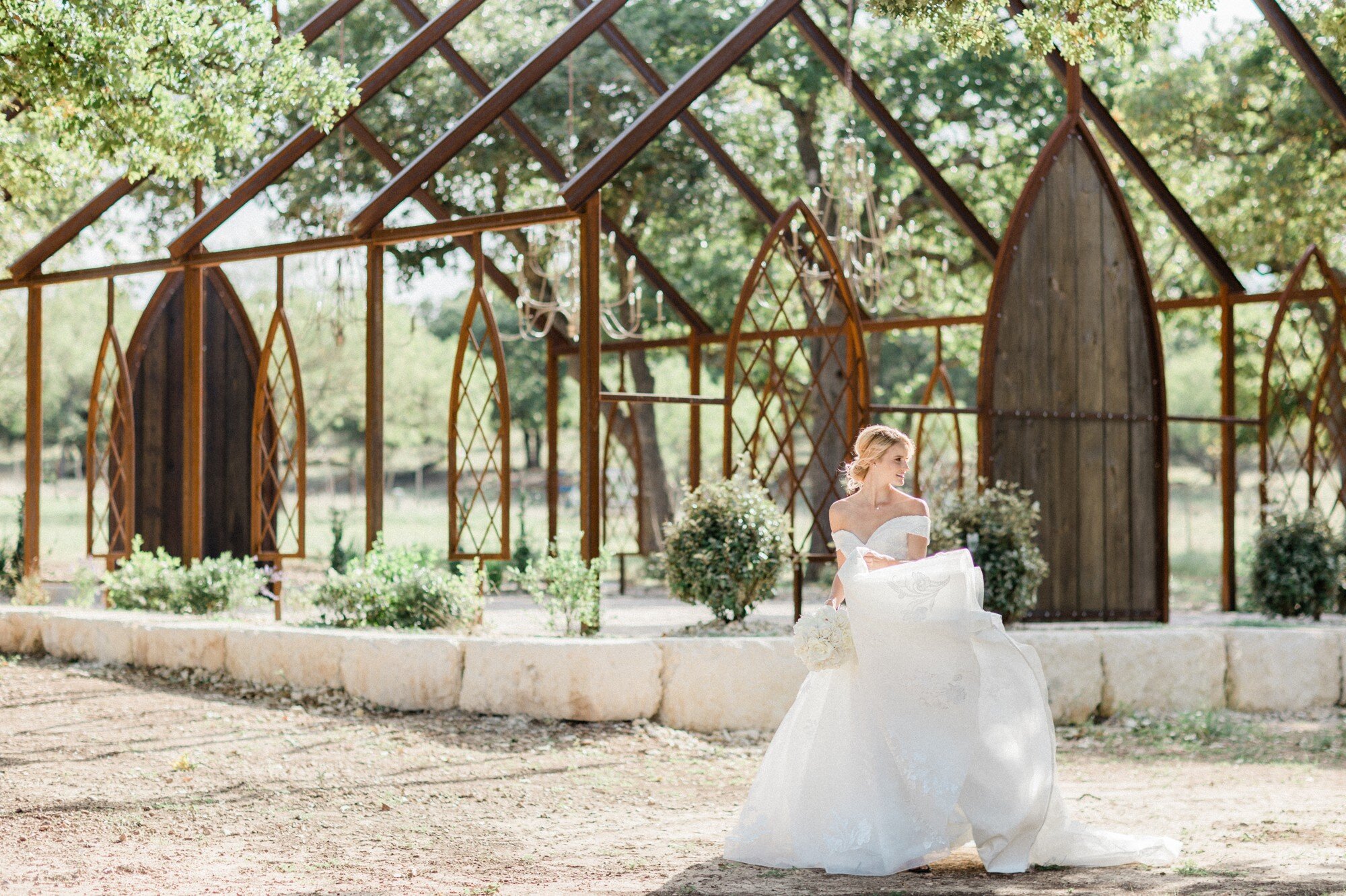  styled wedding photo shoot at Legacy Ranch, Fredericksburg, Texas, luxury light and airy Austin wedding photographer Dreamy Elk Photography and Design, Fiancee Bridal Boutique Boerne, Sunny Hair and Makeup, Form to Feeling, open air steel framework 