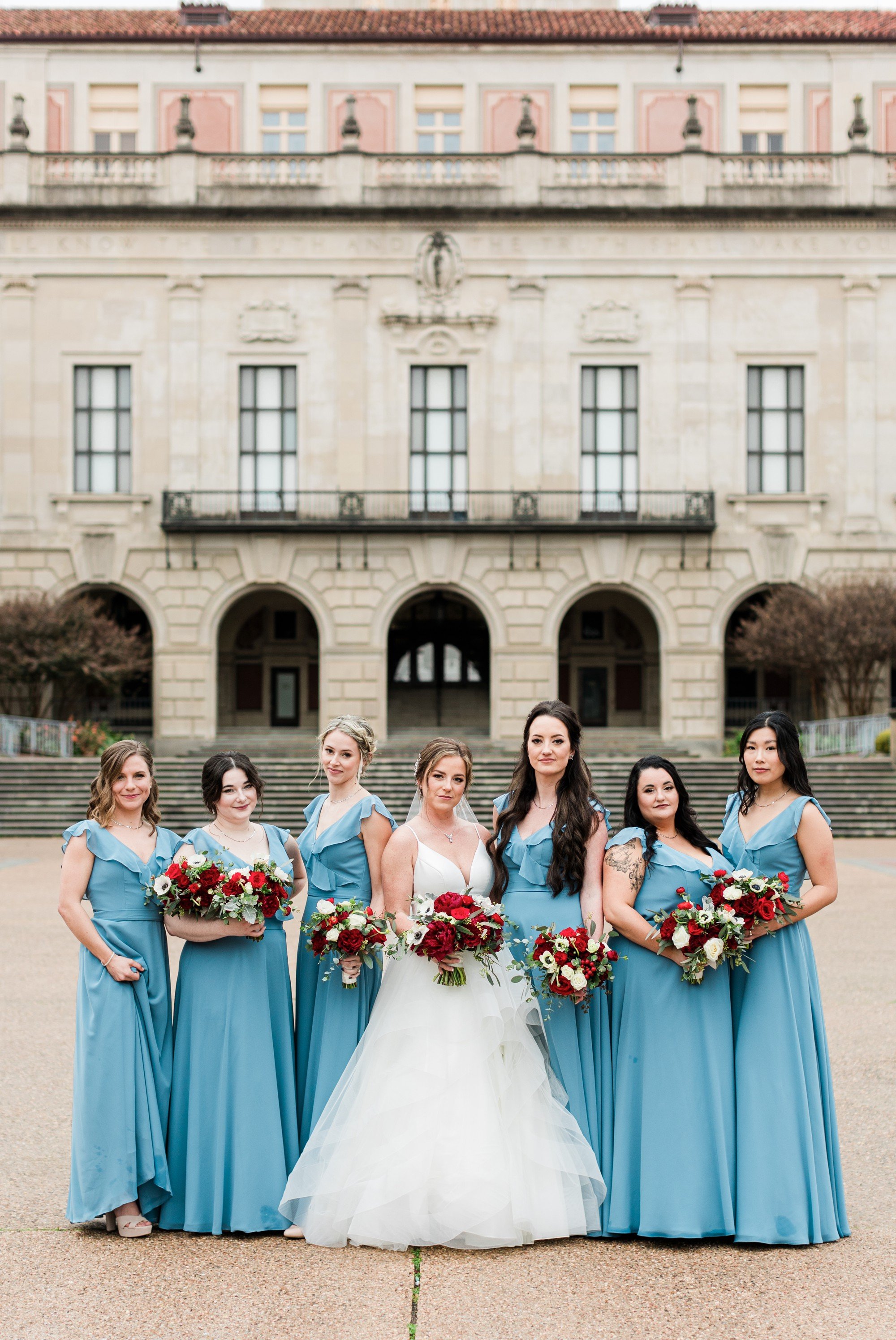 blue bridesmaids dresses with red flowers