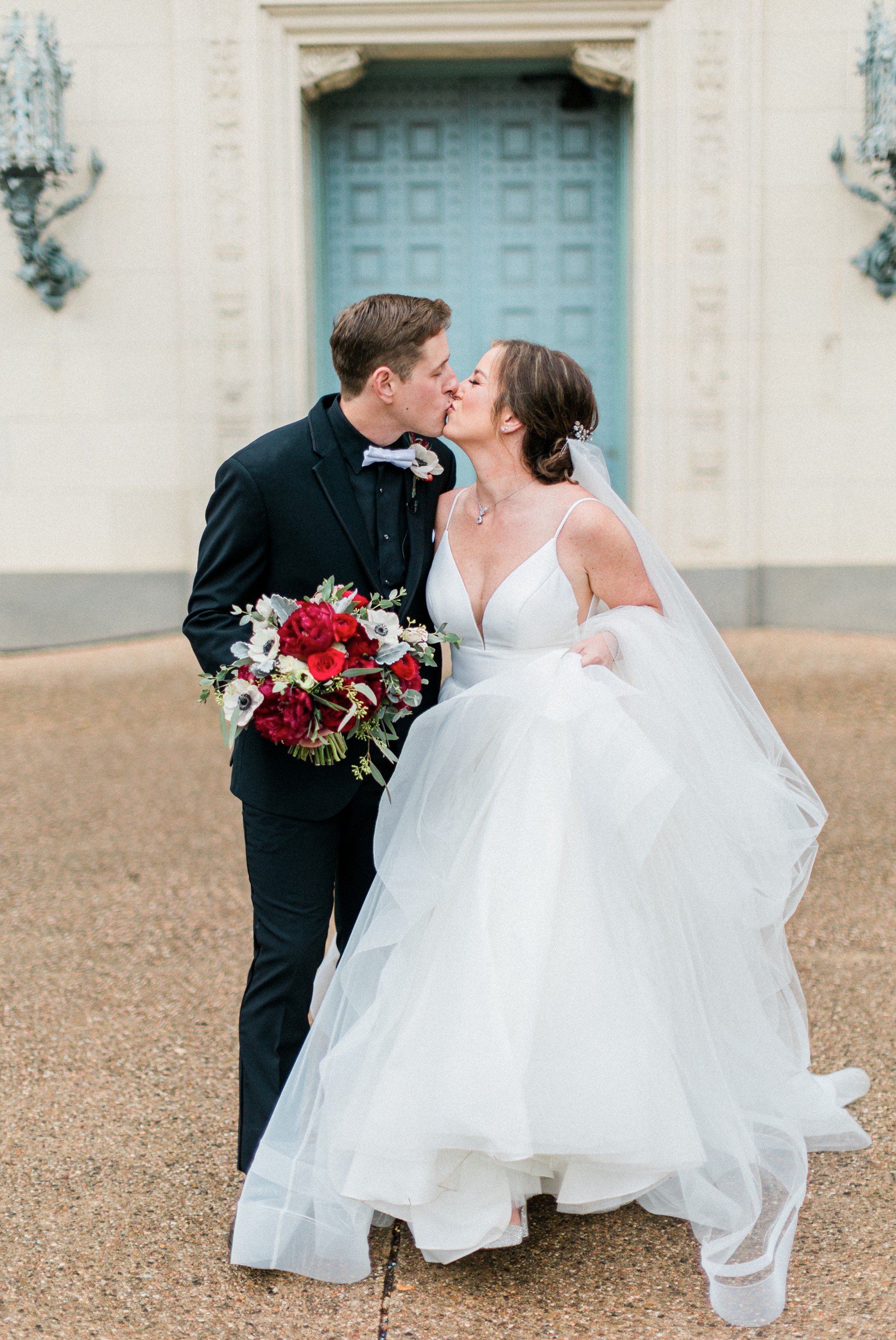 deep v wedding dress and red flowers