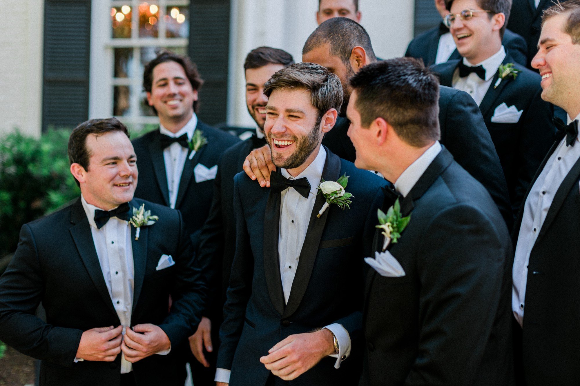 groom and groomsmen laughing