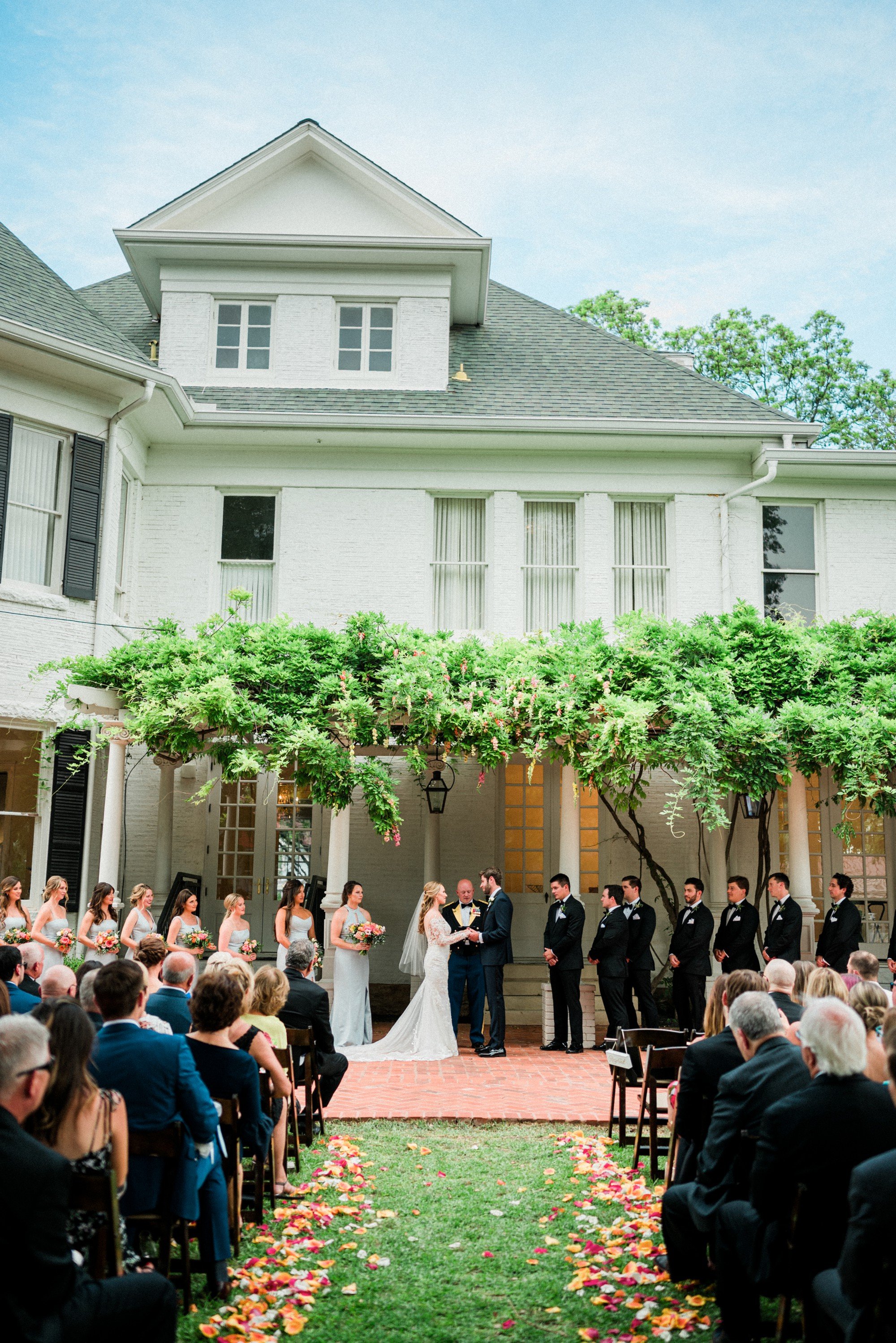 ceremony under an ivy trellis at historic home