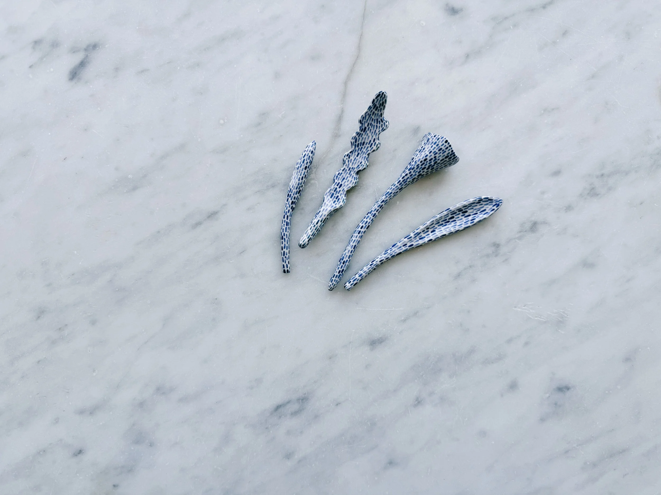 Blue and white, handmade ceramic sculpture.