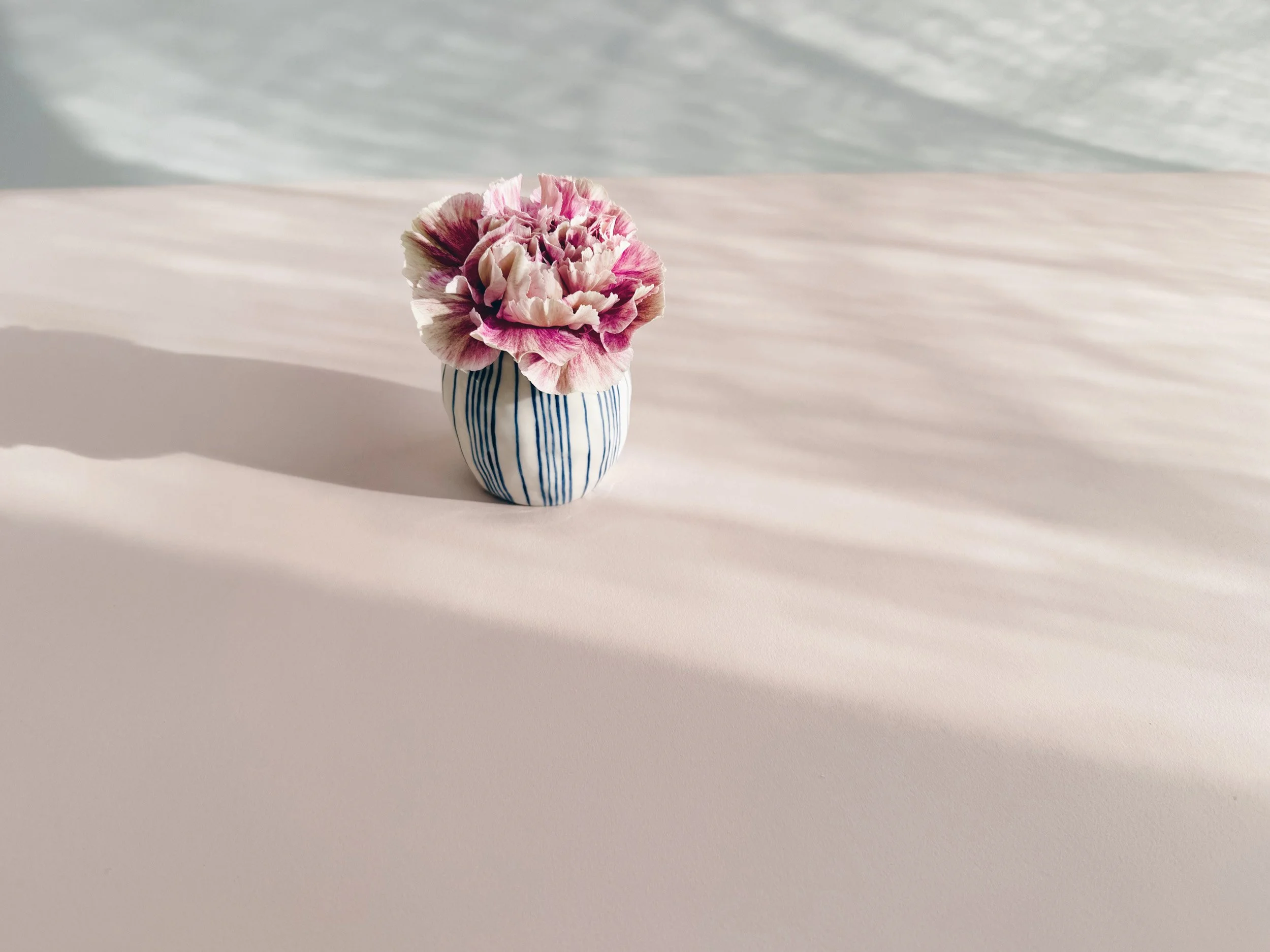 Blue and white, handmade ceramic vase.
