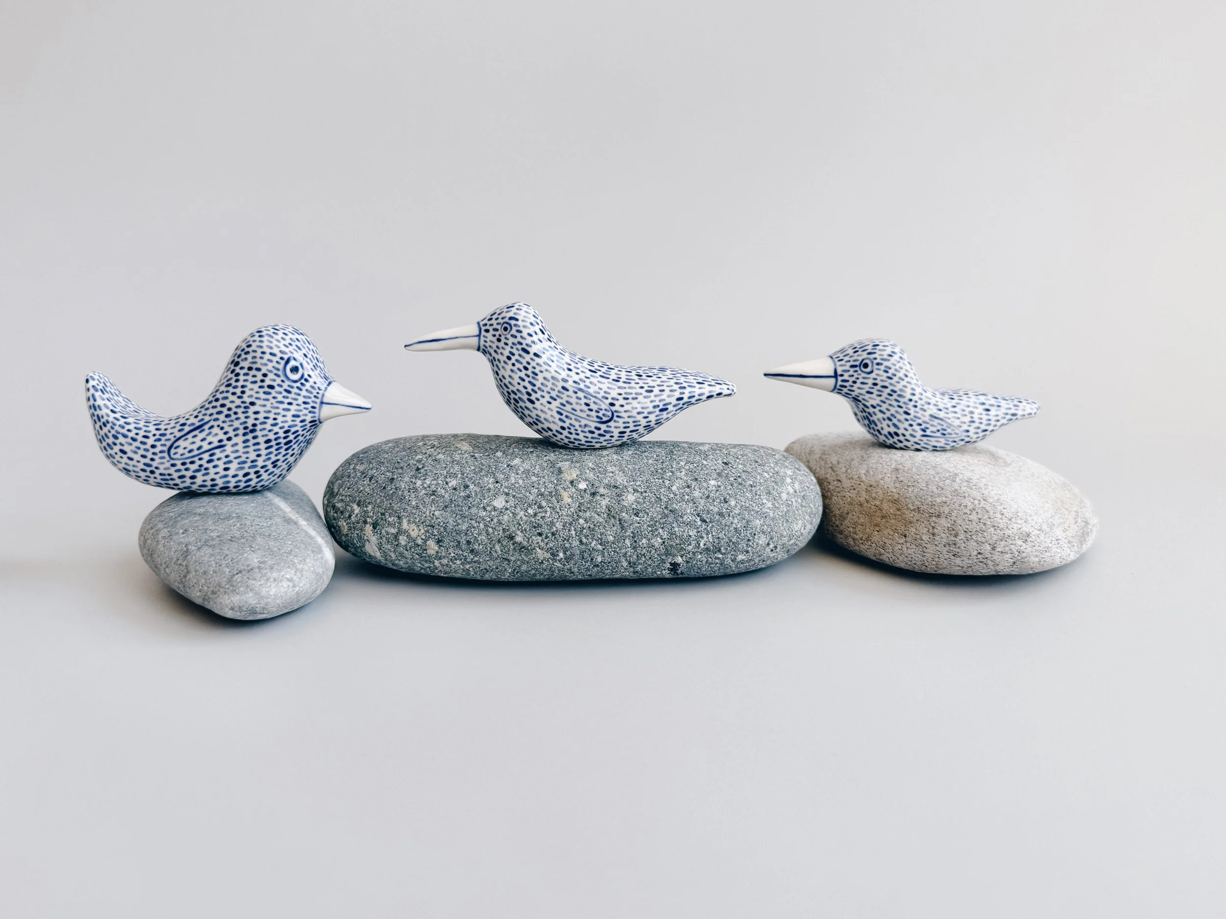 Blue and white, handmade ceramic bird.