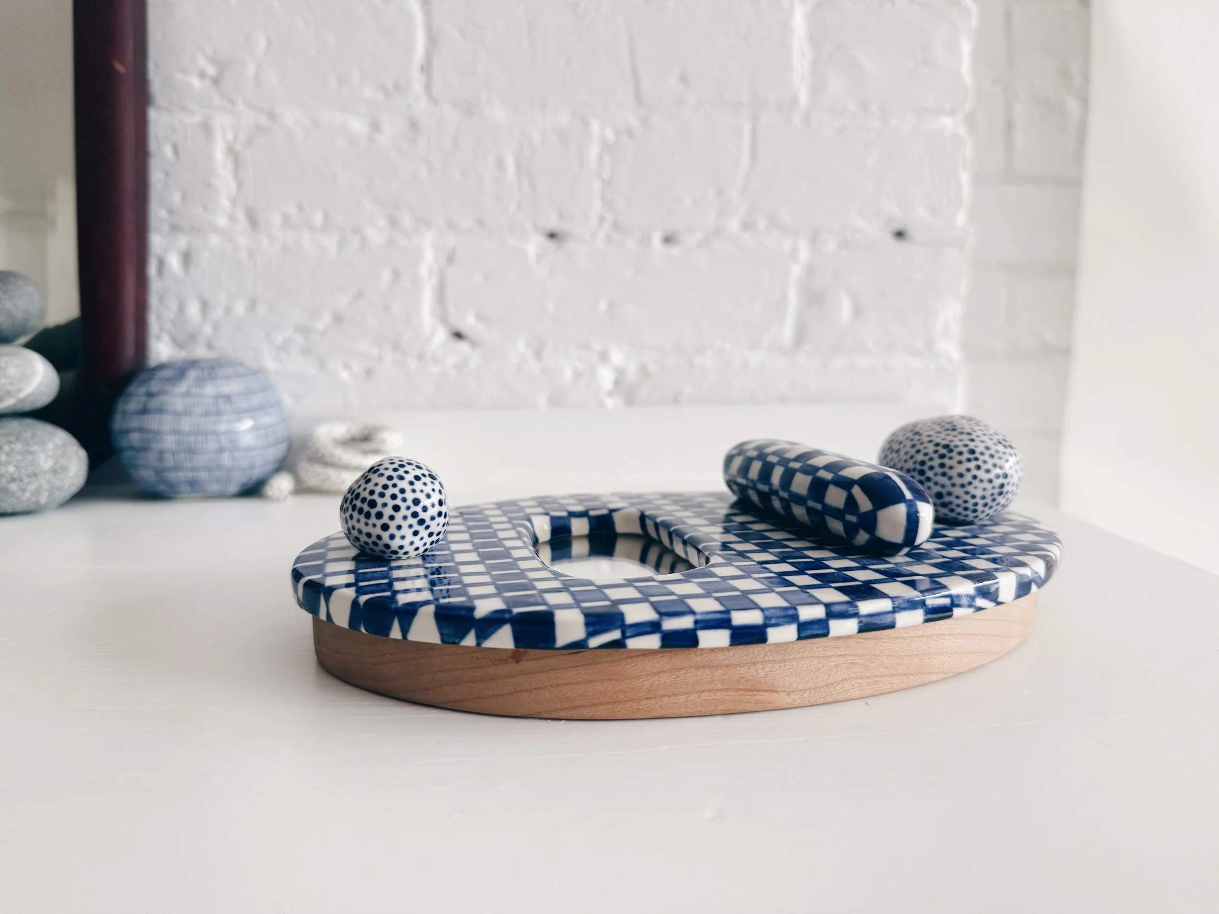 Blue and white, handmade ceramic mirror.