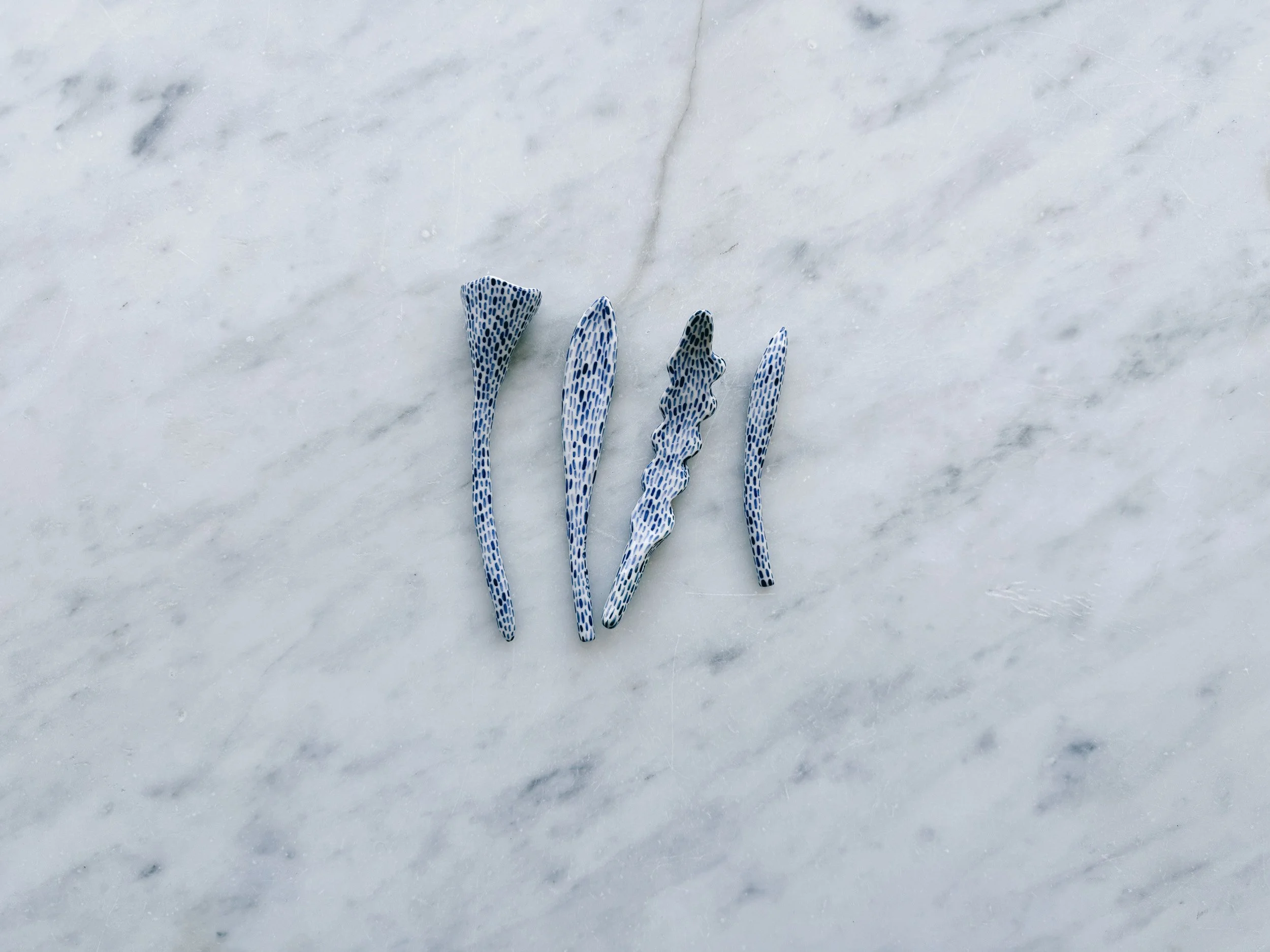 Blue and white, handmade ceramic sculpture.