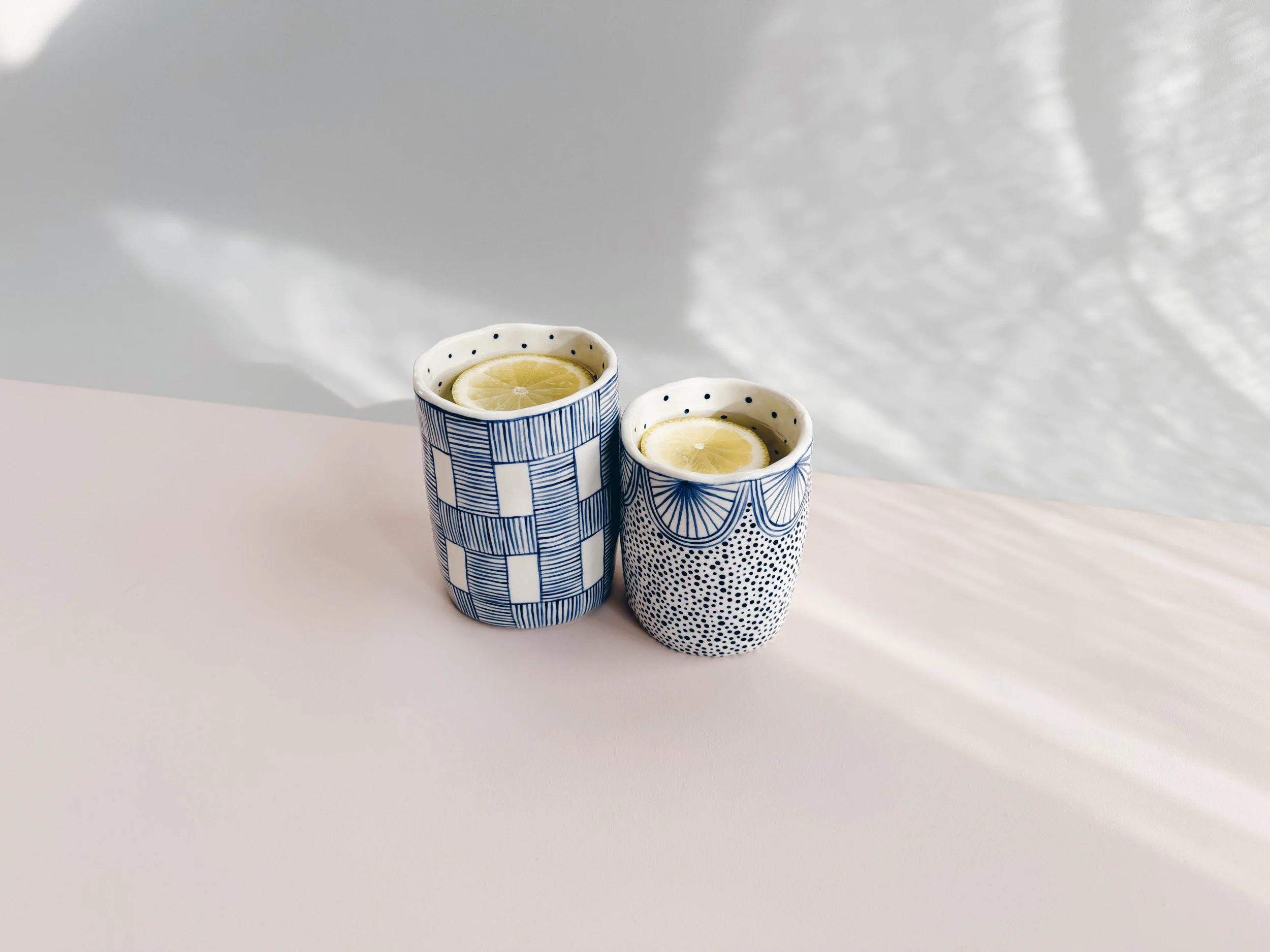Blue and white, handmade ceramic cup.