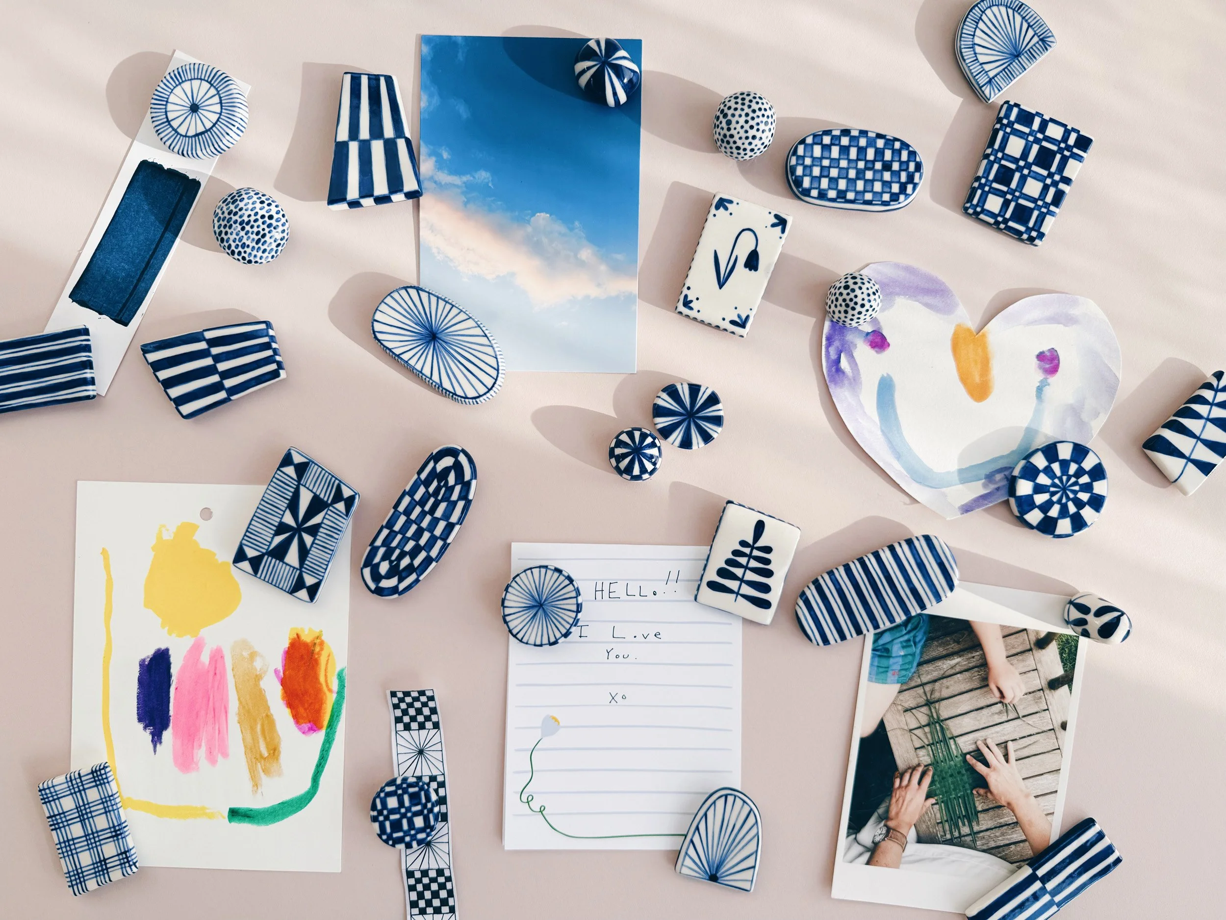 Blue and white, handmade ceramic magnets.