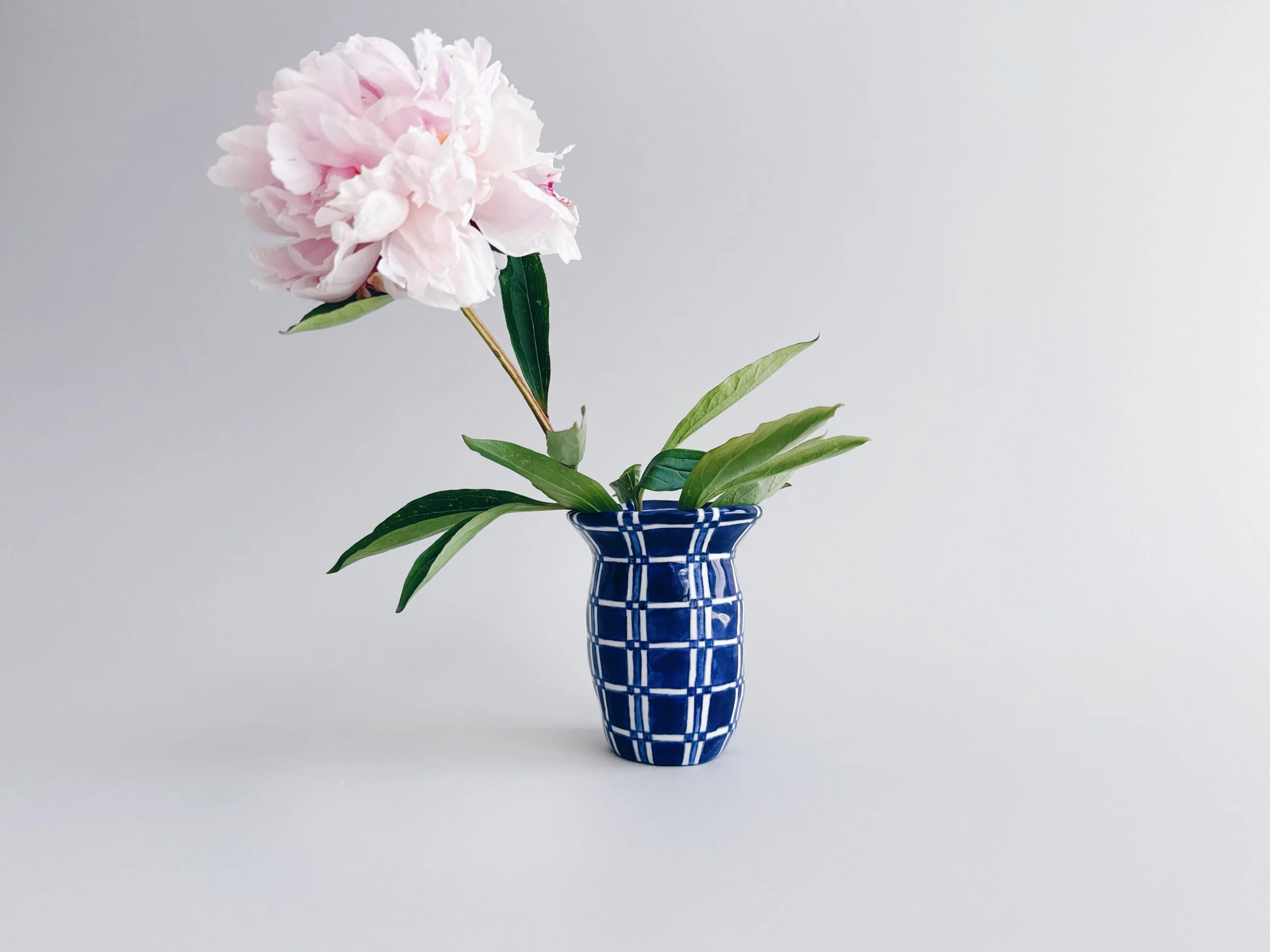 Blue and white, handmade ceramic vase.