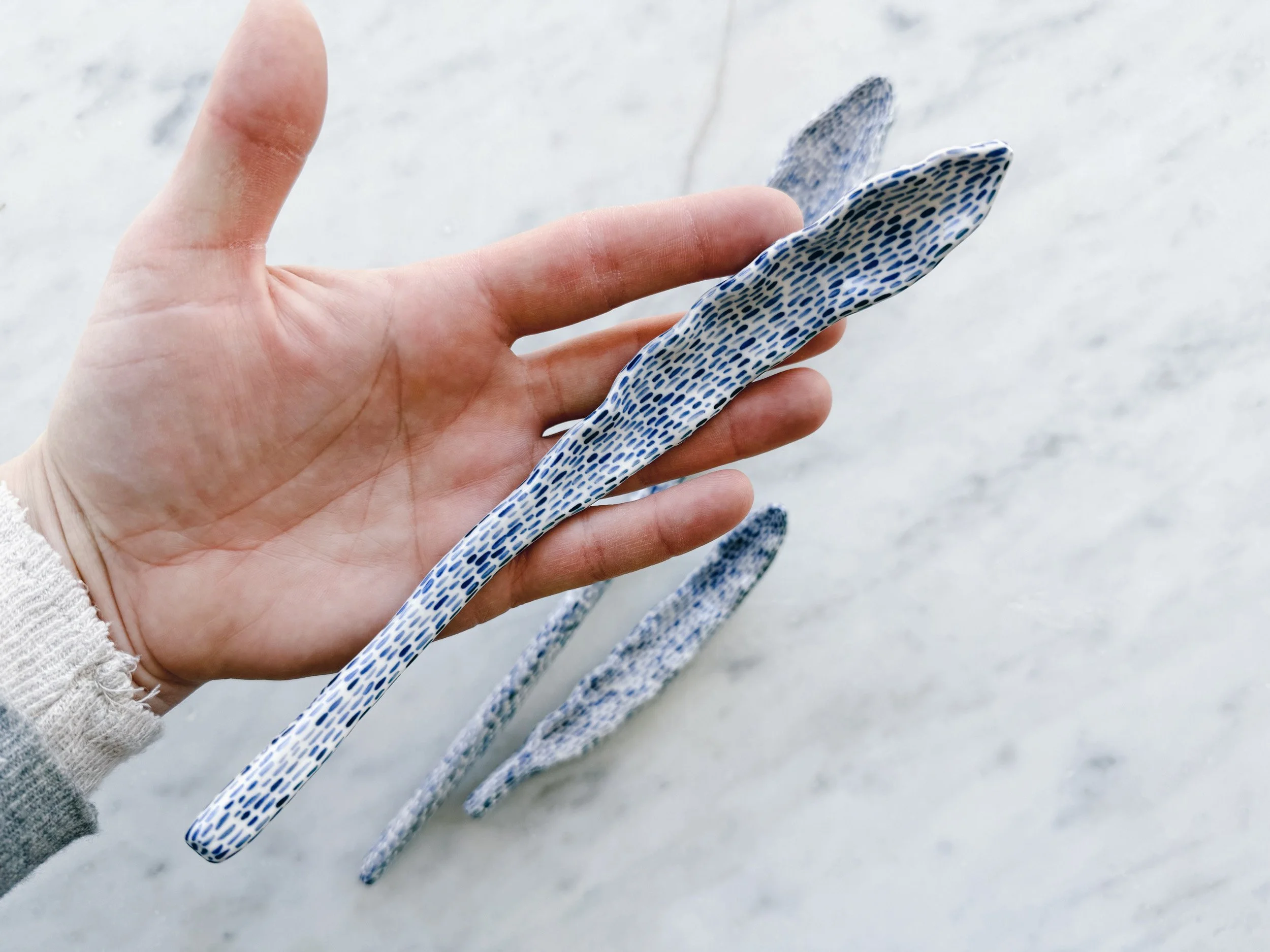 Blue and white, handmade ceramic sculpture.