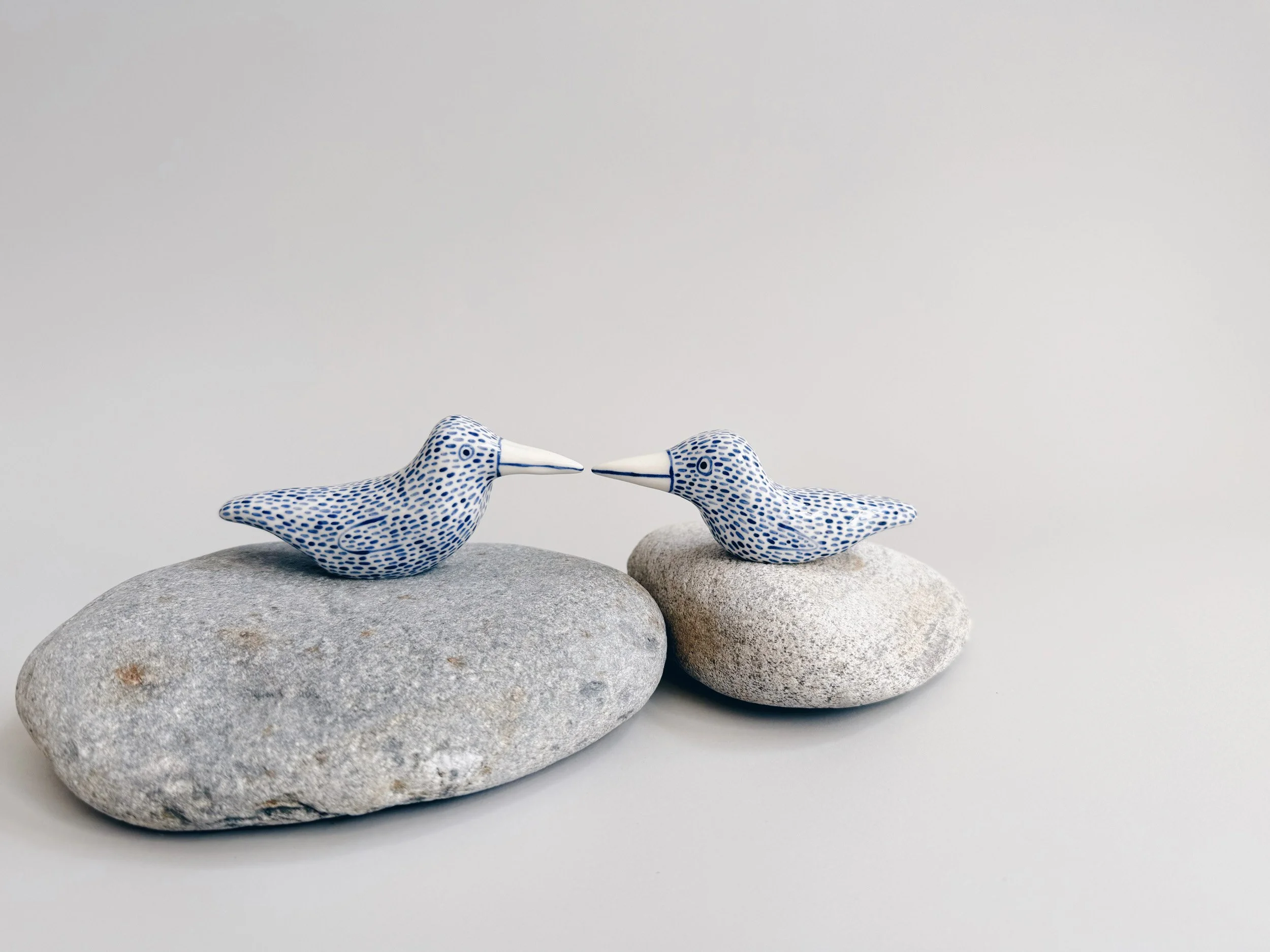 Blue and white, handmade ceramic bird.