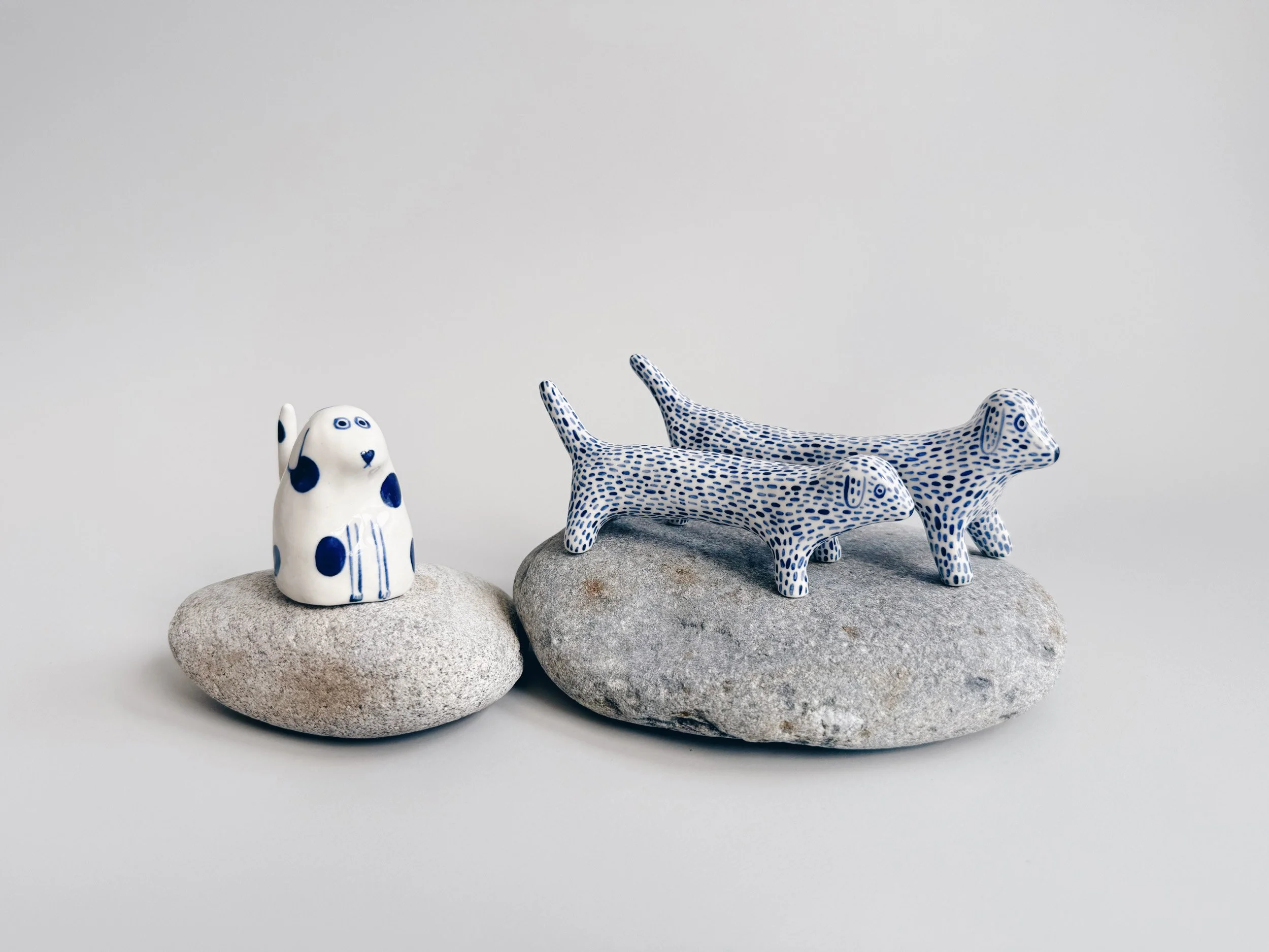 Blue and white, handmade ceramic dog.