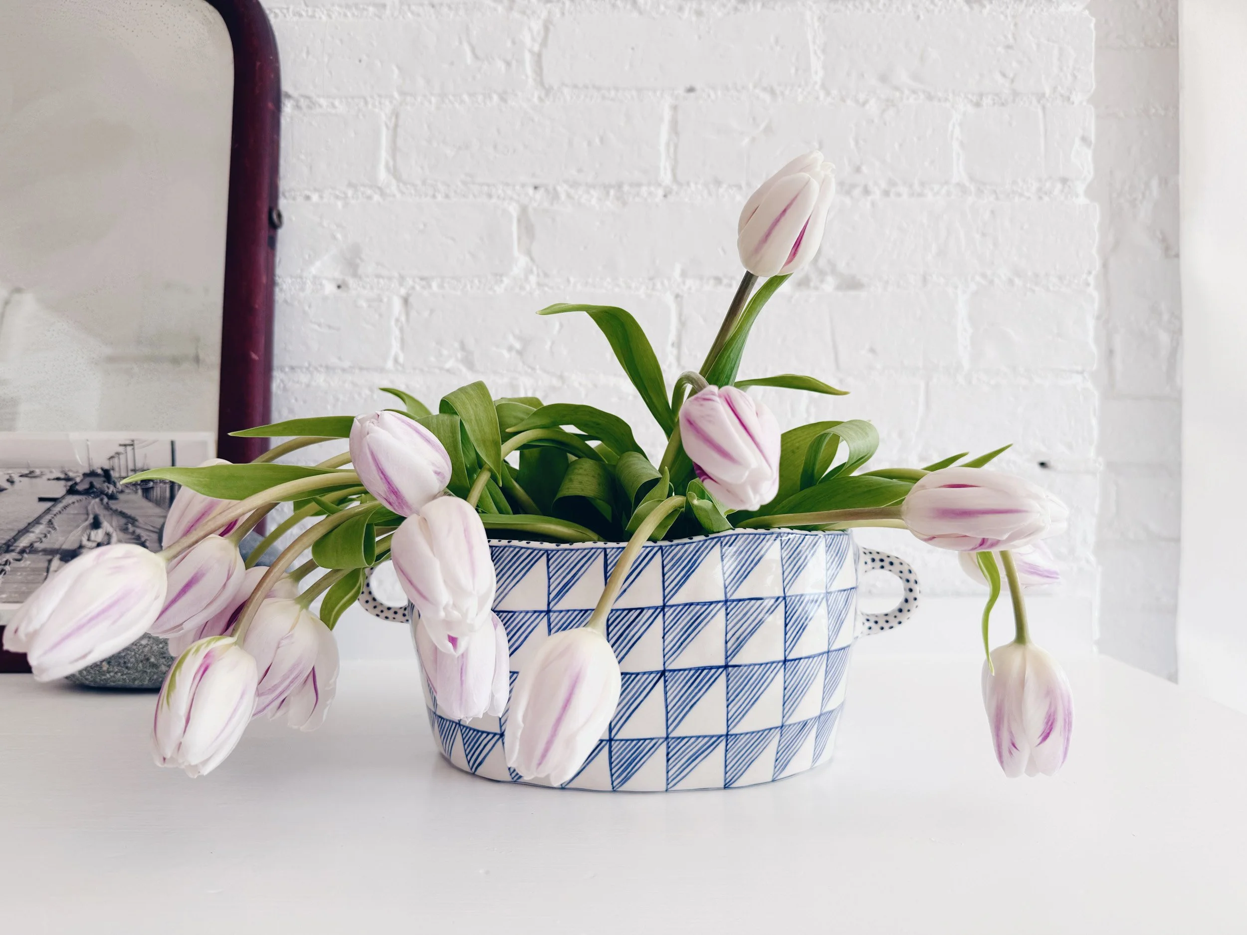 Blue and white, handmade ceramic vessel.