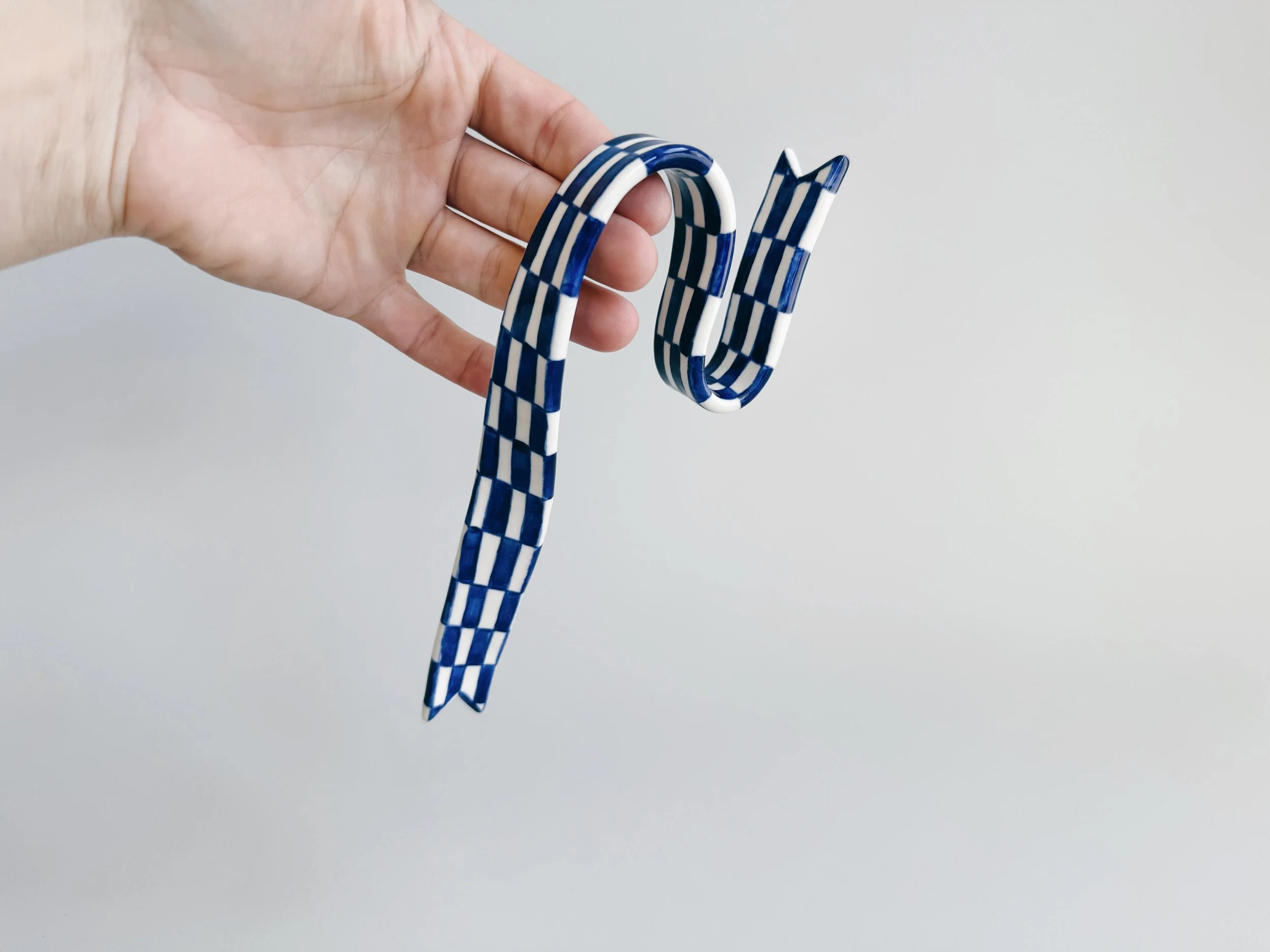 Blue and white, handmade ceramic ribbon