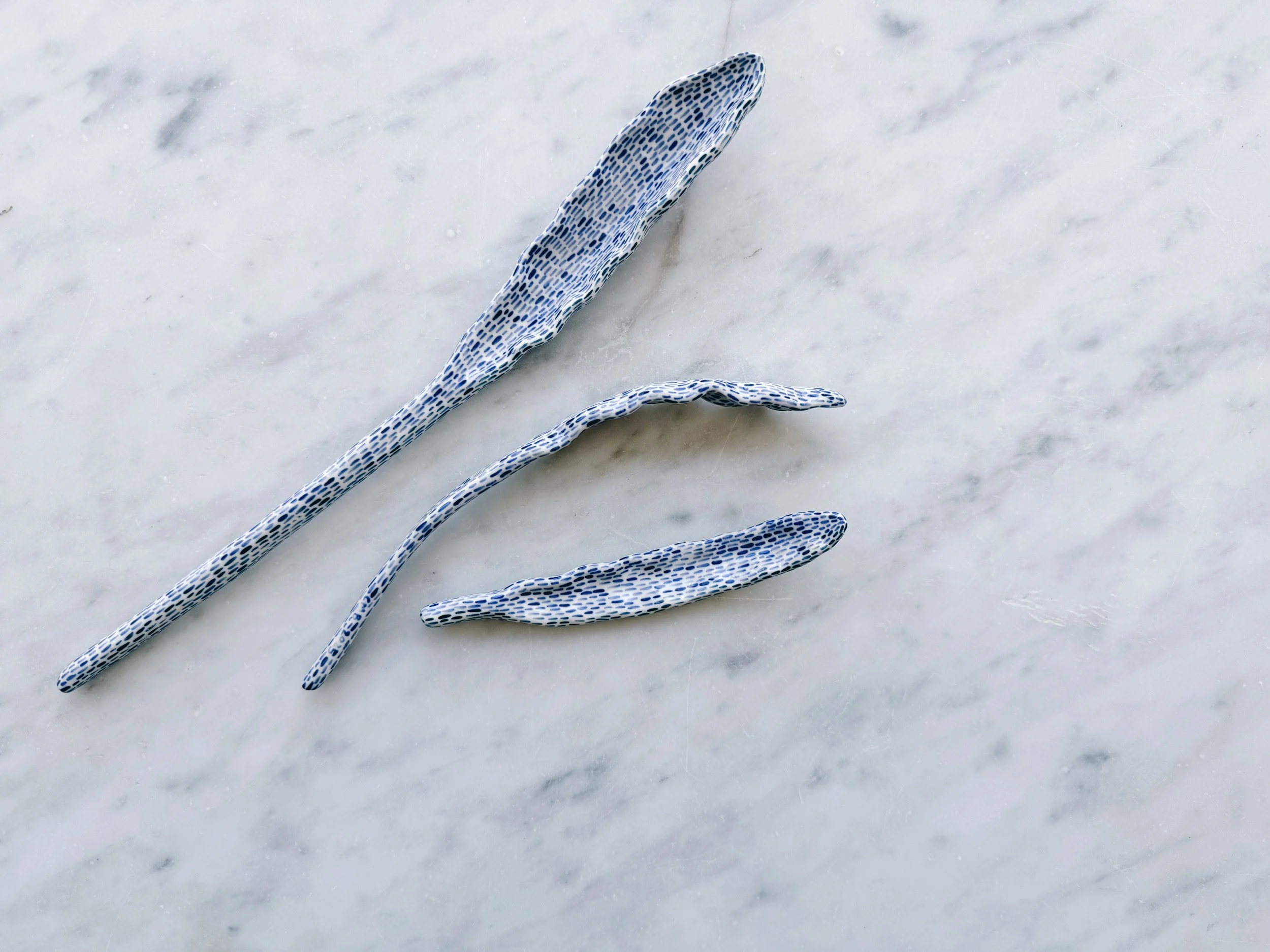 Blue and white, handmade ceramic sculpture.