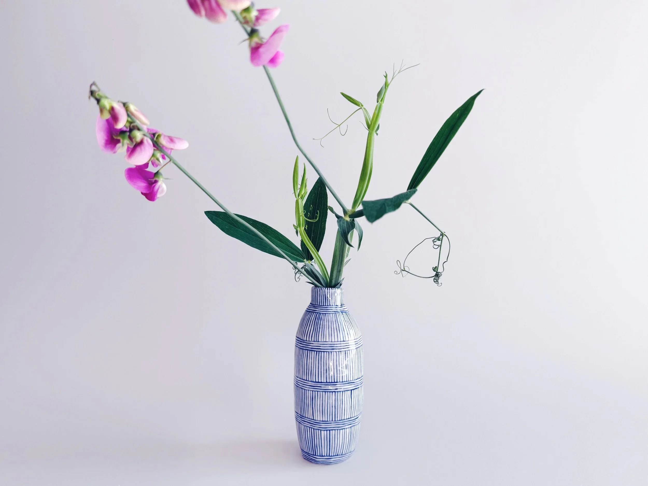 Blue and white, handmade ceramic vase.