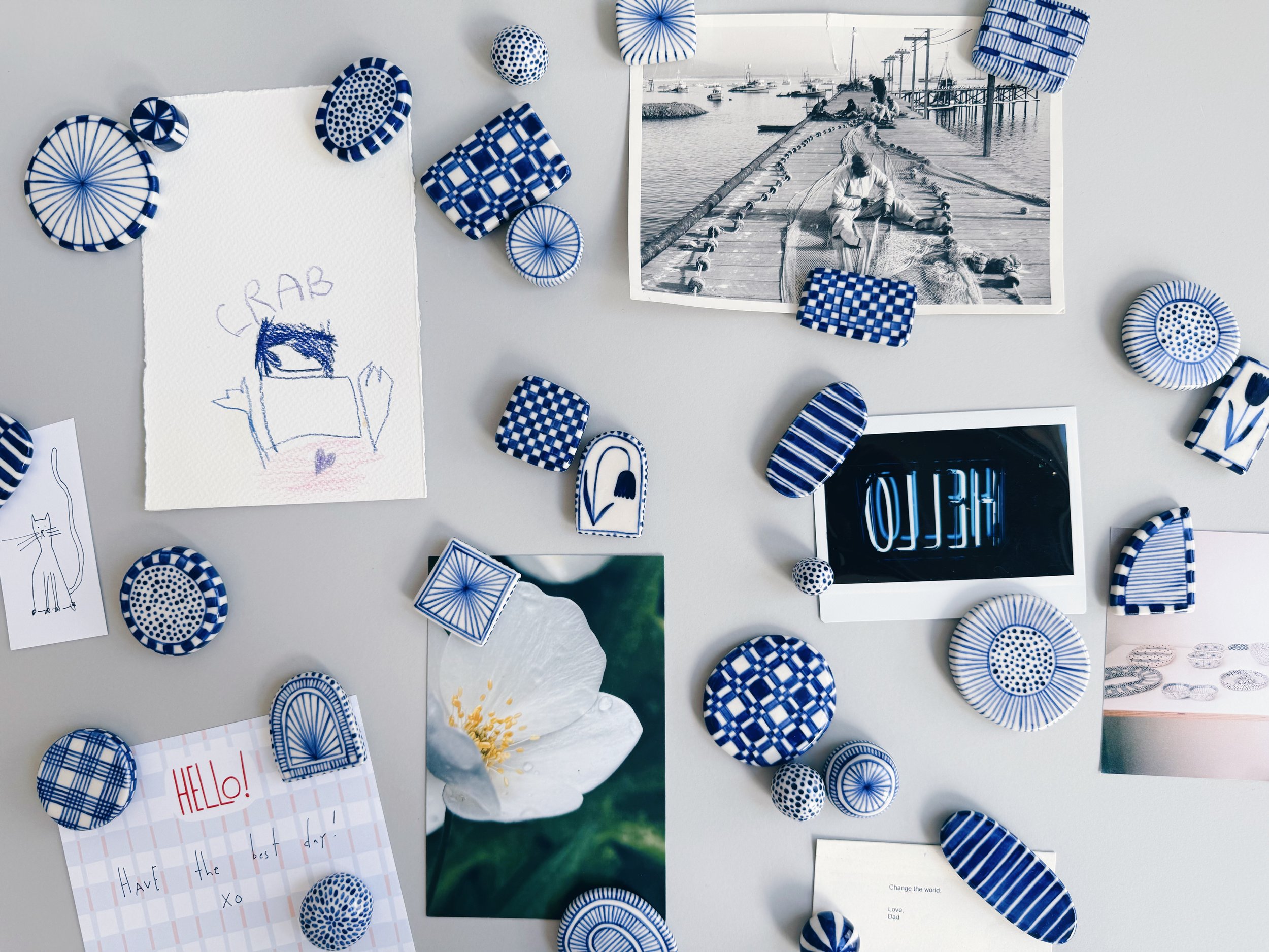 Blue and white, handmade ceramic magnets.