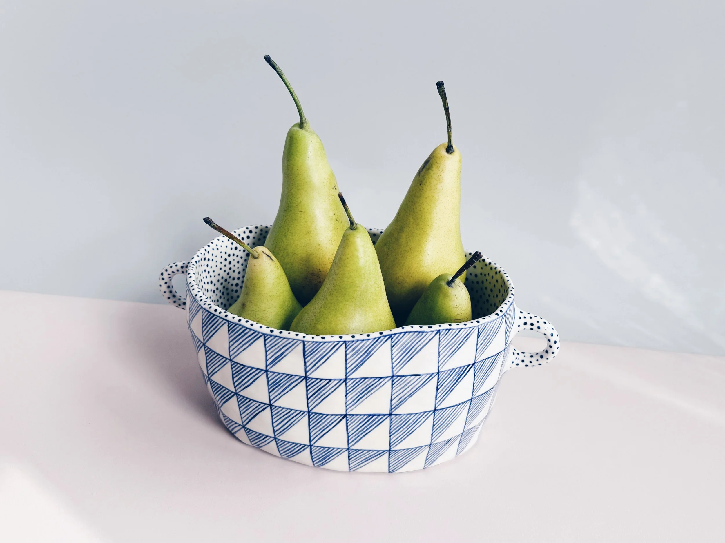 Blue and white, handmade ceramic vessel.